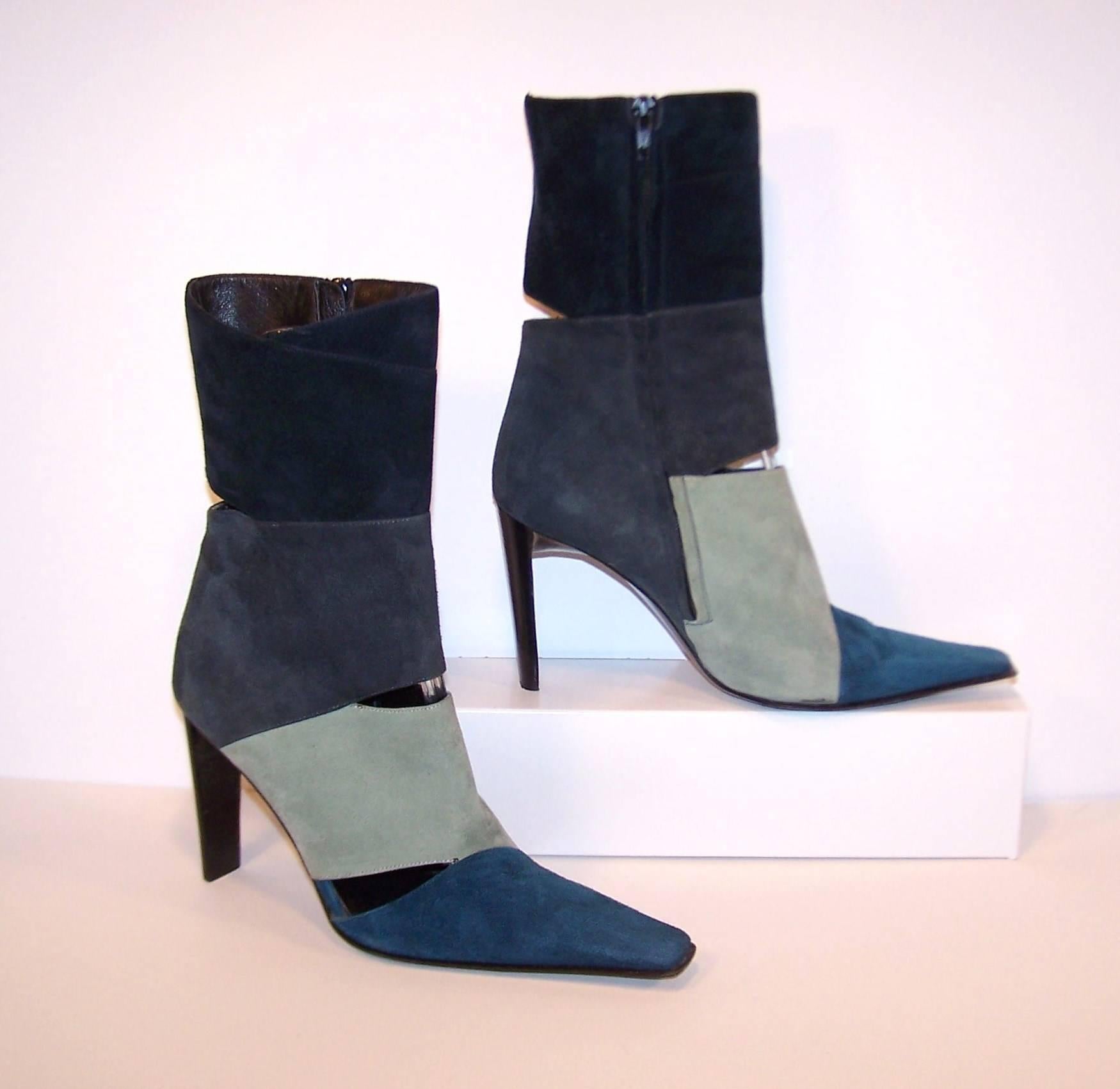 These contemporary ankle boots by Italian designer, Goffredo Fantini, have a mod aesthetic reminiscent of styles from the 1970's.  The multi-color suede pattern begins at the toe with a peacock blue and moves up the color spectrum with icy blue-gray