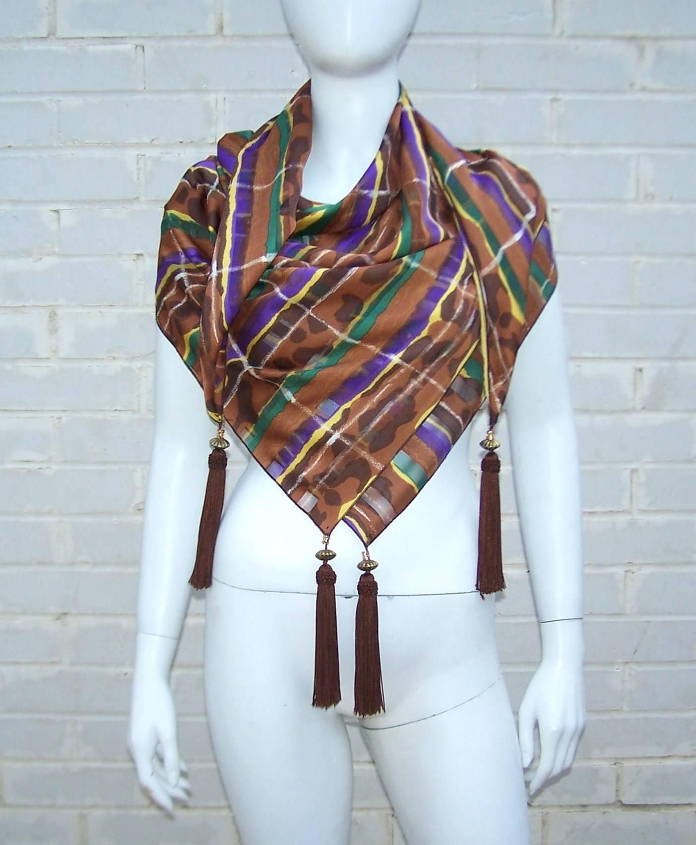 Treat this silk jacquard scarf like a piece of fashion jewelry.  The weighty brown tassels with brass beads serve to create a balance on all four corners so you can artistically drape the scarf and create many different looks.  The striped design