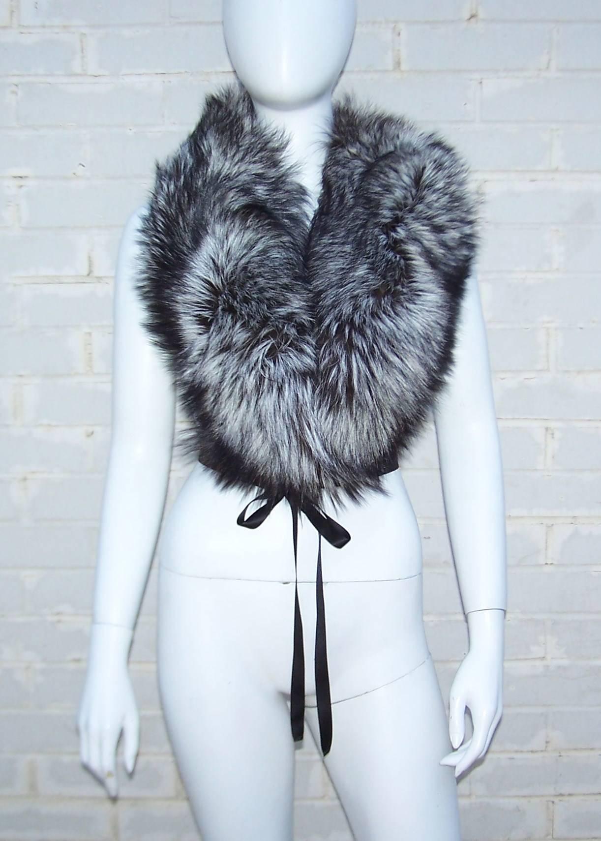 This is the perfect fur accessory for a winter wardrobe.  The versatile size of the collar and length of the black satin tie enables you to add it to coats, jackets, sweaters and just about anything for warmth and glamour.  The silver tip fox fur