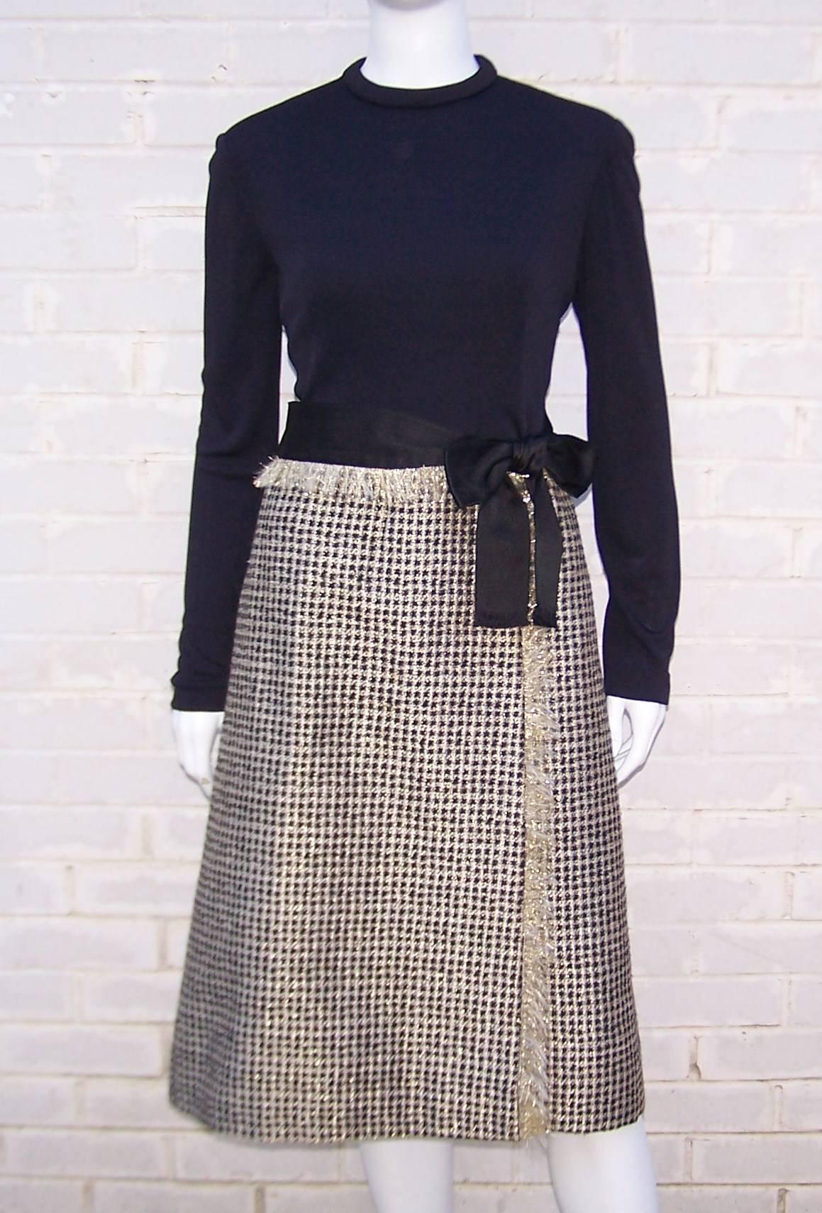 It's all about the fabrics for Mr. Weinberg and this dress is an elegant example.  Wool black and gold houndstooth is expertly mixed with a black jersey bodice to create an understated dress with just the right amount of glam to make it perfect for