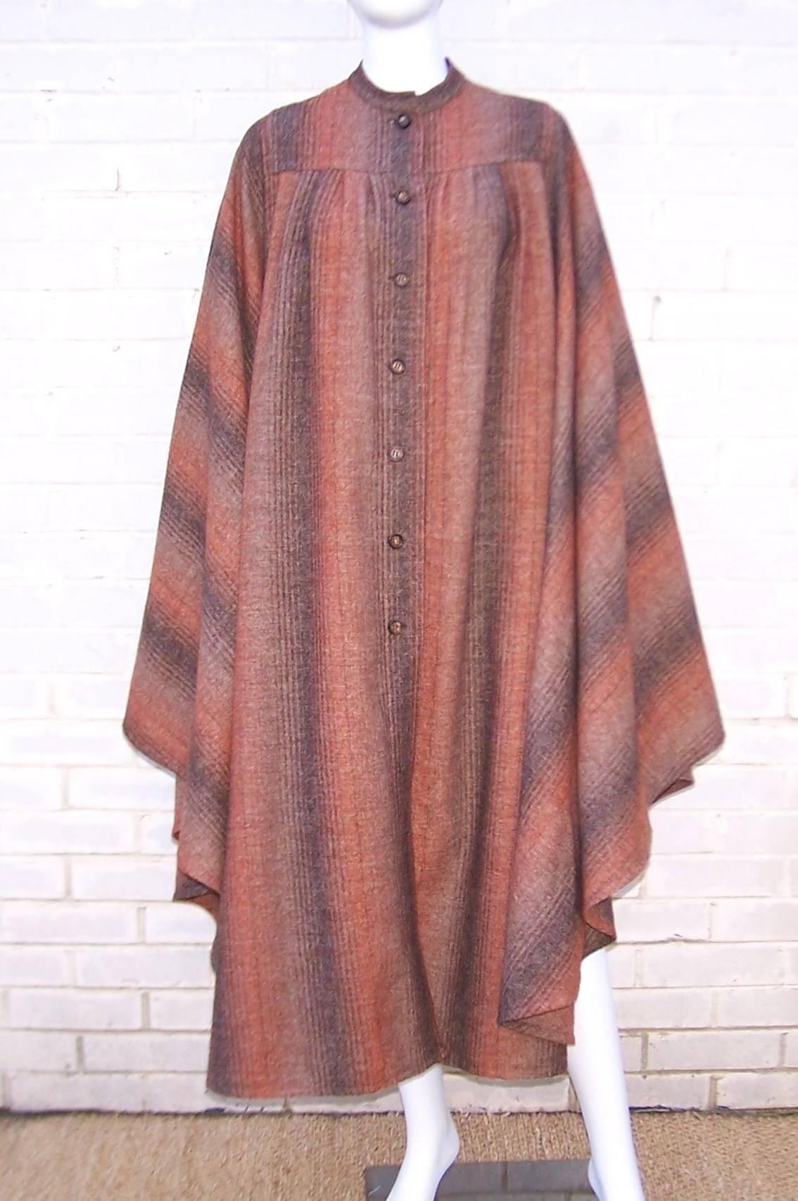Fall is in the air and it's time to pull out a fashionable wrap.  We have the perfect thing!  This Lanvin wool cape is a classic brown autumnal tweed with the bohemian feel of the 1970's.  Unstructured and designed to billow dramatically with every