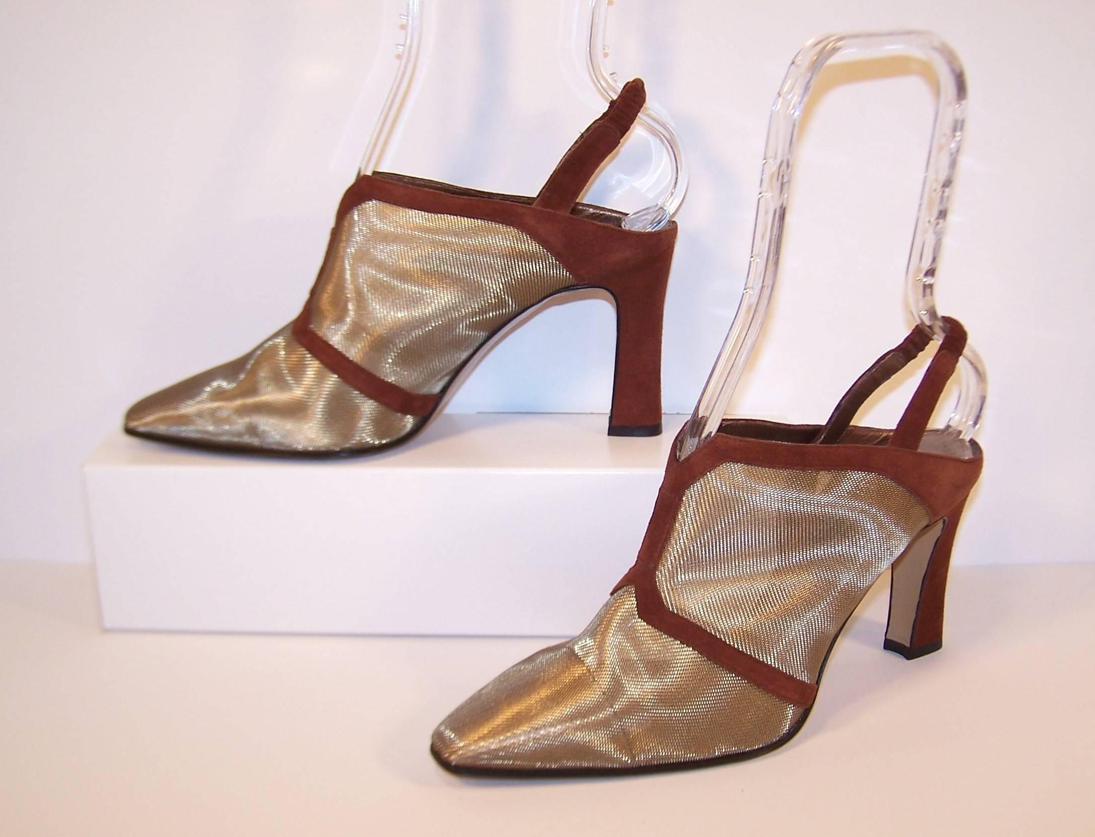 This slingback shoe by Comcedia has the look of a fierce bootie.  The body of the shoe is formed of fine gold mesh resembling a screen.  It is trimmed in chocolate brown suede with a covered elasticized slingback.  Both the slingback and 3.5"