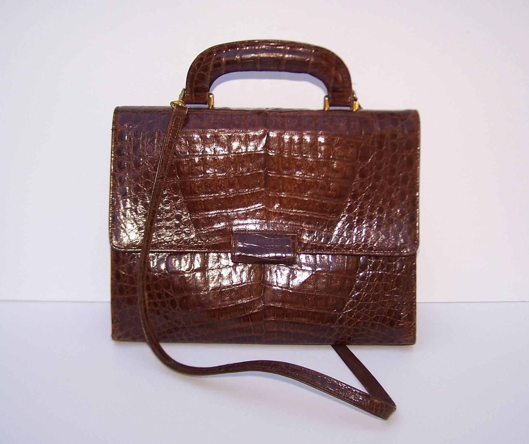 This classic crocodile handbag is brought to you from the talented hands of former fashion editor, Frances Patiky Stein.  Ms. Stein has worked for everyone from Vogue to Glamour.  She also served as artistic director for Chanel accessories in the