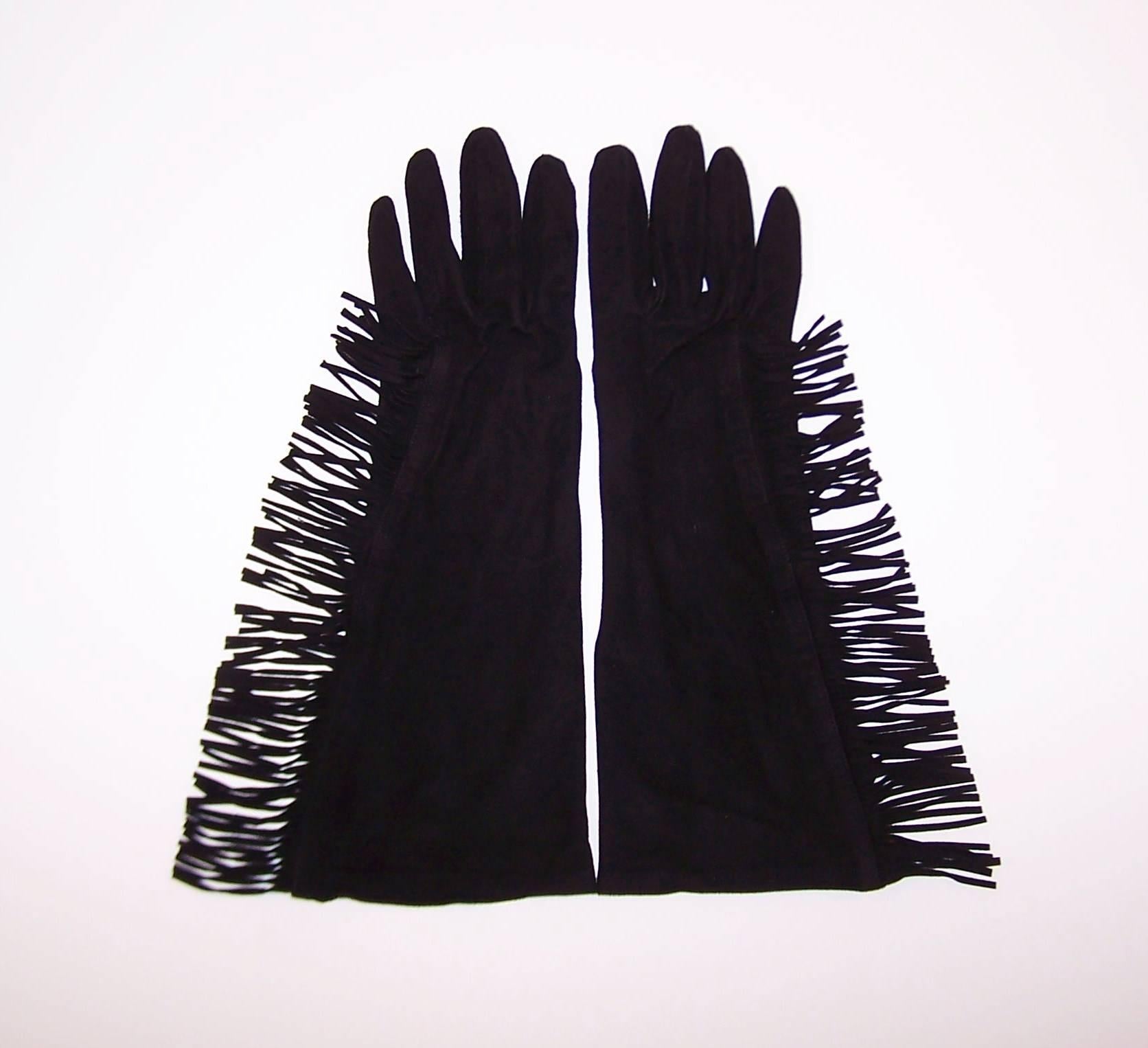 Fringe is in!  Of course, it never really left and here to prove the point are a pair of 1980's Yves Saint Laurent black kidskin suede gloves with silk lining.  The gloves are 3/4