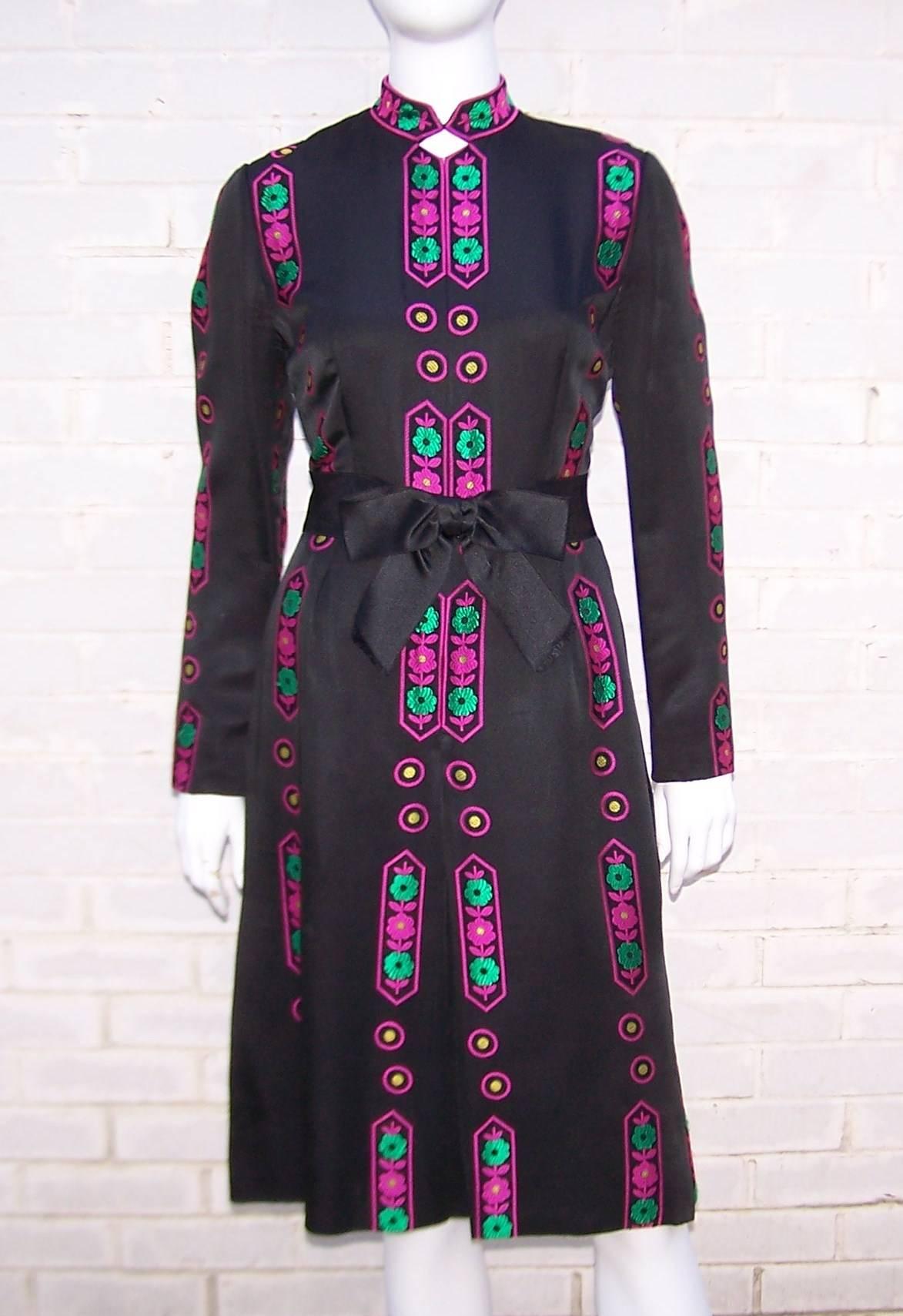 If you are tired of the little black dress then look no further.  This Adele Simpson Asian influenced design has all the versatility of the 'LBD' with a good dose of vibrant color to liven the senses.  The black satin fabric features a graphic