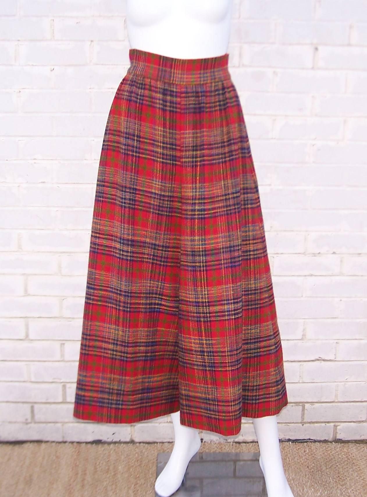 Tartan attack!  These wide legged pants are masquerading as a skirt which provides the best of both worlds.  The wool plaid incorporates red, blue, black, green and a touch of yellow.  They zip and hook at the back with a high and wide waistband.The