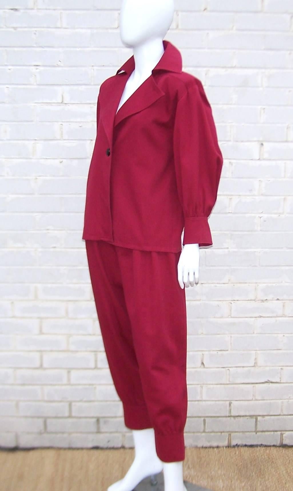 Is it possible to be uber stylish and whimsically playful at the same time?  Yes!  And this Yves Saint Laurent cranberry red heavy weight cotton suit proves it with one playful detail after another.  This design has all the hallmarks of an adult