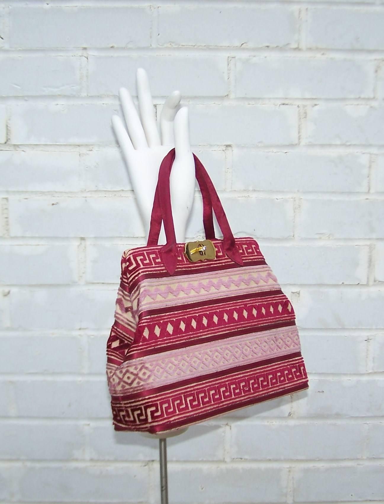 We are big fans of Roberta Di Camerino handbag designs...each one is like a precious tactile treasure.  This 1950's design for Lord & Taylor has a petite carpetbag sensibility in a wonderful graphically printed ruby red cut velvet.  The turn lock