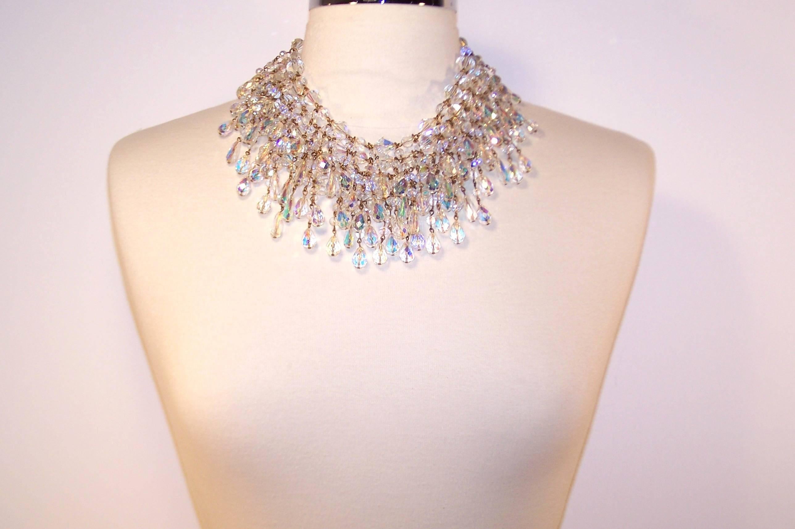 Stunning!  Wear the stars at your neck with this five strand faceted crystal necklace.  Each crystal emits an iridescent  blue and pink sheen which lightens everything around it.  Though the necklace is unsigned, it is high quality and well