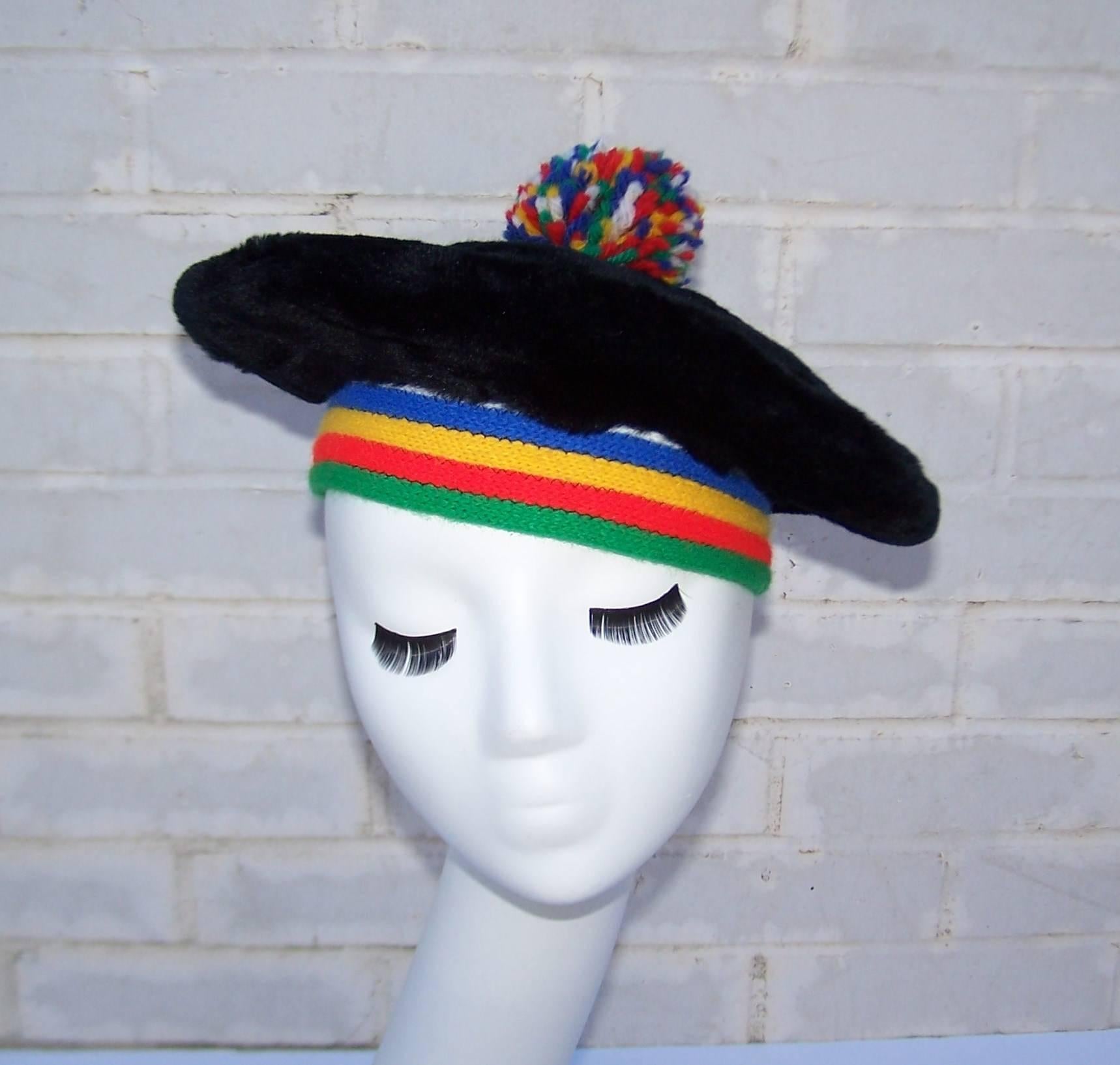 Love this 1970's era black faux fur beret with rainbow colored wool knit rim and a playful yarn pom pom.  Such a fun vintage accessory to add to a modern wardrobe with the added bonus of warmth on a cold day.  Excellent vintage