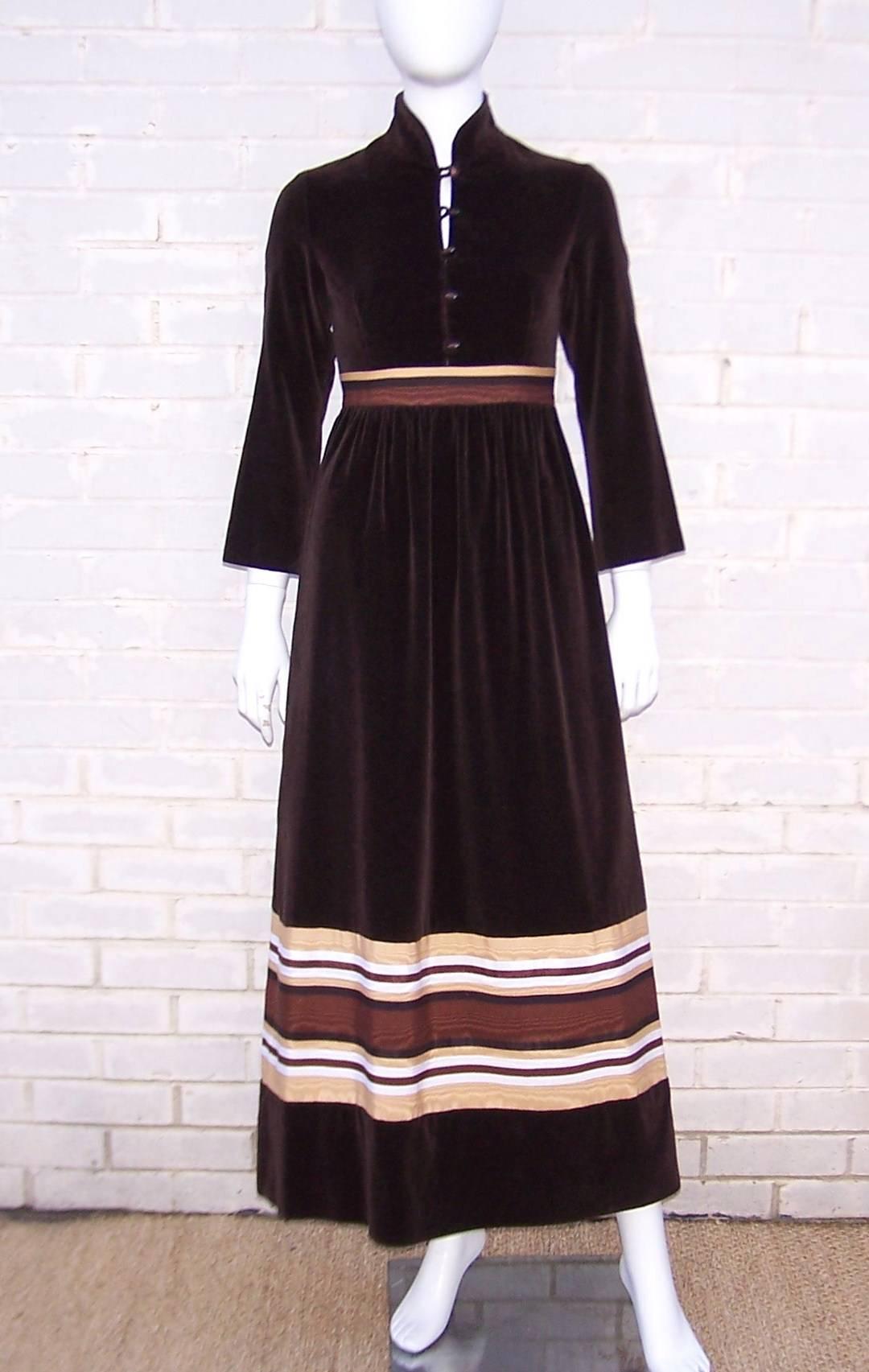 Kay Unger lent her ladylike aesthetics to the A.J. Bari label during the 1970's and this lovely little dress is an example of her work.  The chocolate brown velveteen is graphically enhanced with a tricolor moire fabric at the waist and near the