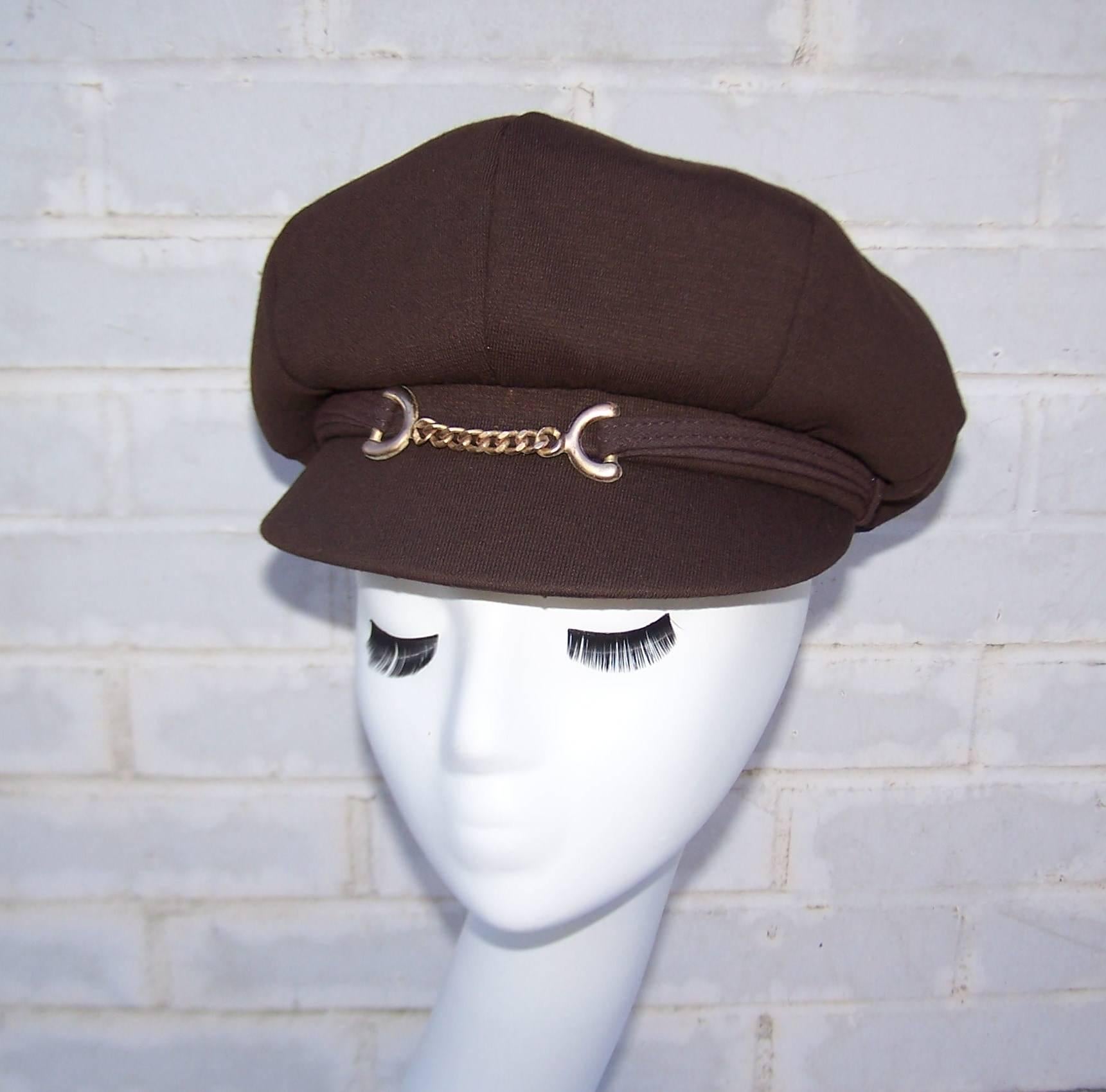 What a great vintage accessory to add to your modern day look!  This chocolate brown wool knit hat is a newsboy style with a mod 1970's twist.  The brim is accented with a sporty Gucci style horse bit hardware and the crown is topped with a