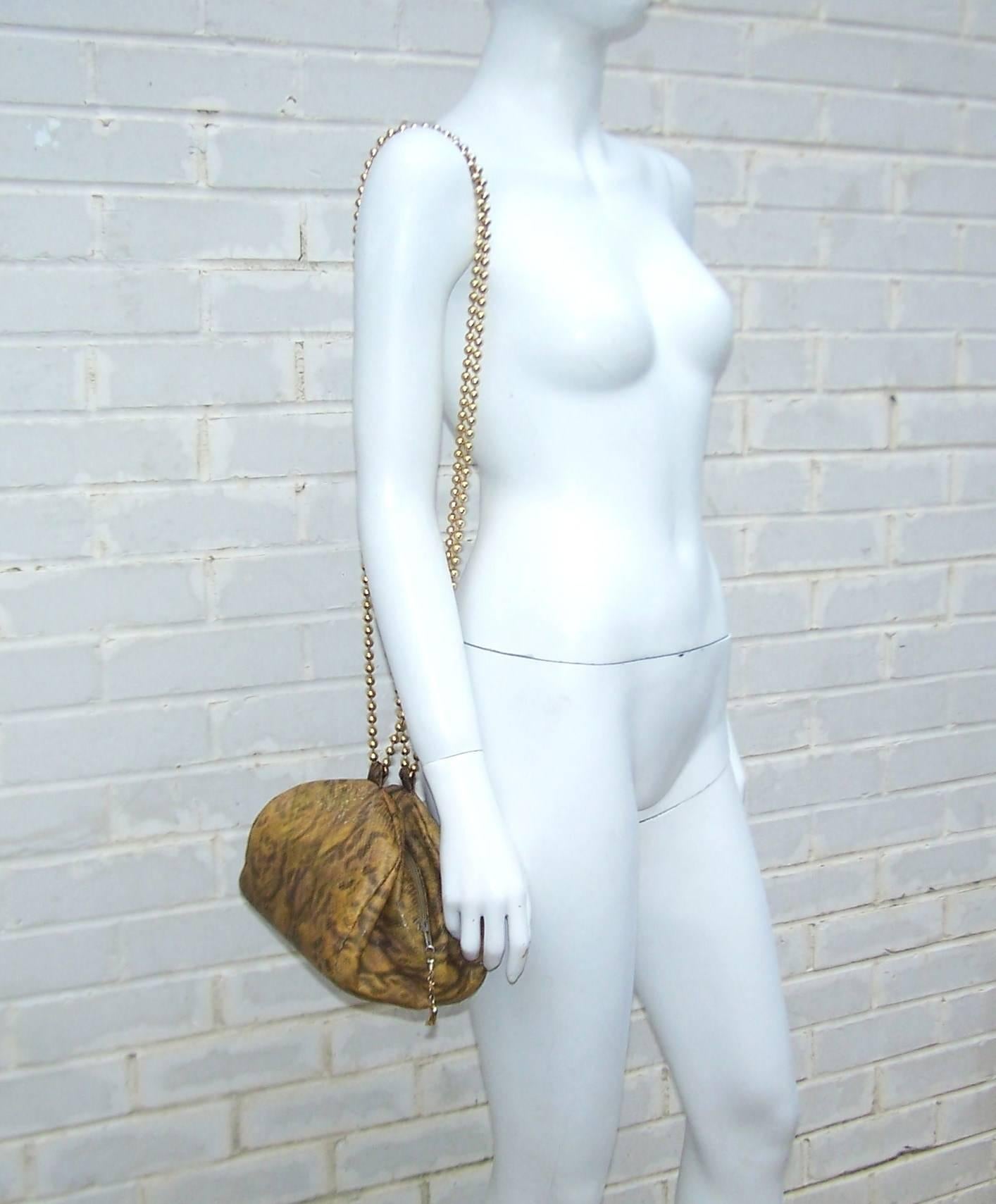 Maud Frizon began her career designing shoes in the 1960's.  By the 1980's she had a well earned reputation for innovative designs using quality materials.  This amazing sack shaped snakeskin handbag is cinched together with a zipper and a snap. 