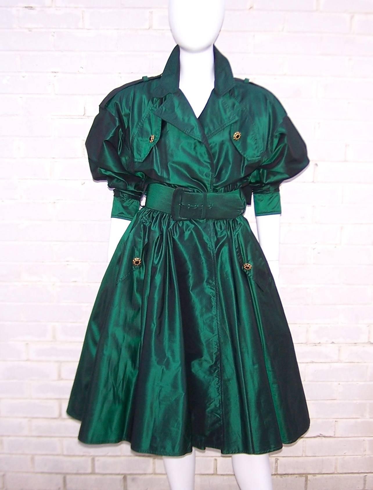Michael Casey's background as a costume designer is at work on this dramatic green taffeta trench coat style dress. The fabric is pure silk backed with netting at the skirt and fully lined for comfort. The effect is a voluminous skirt which is