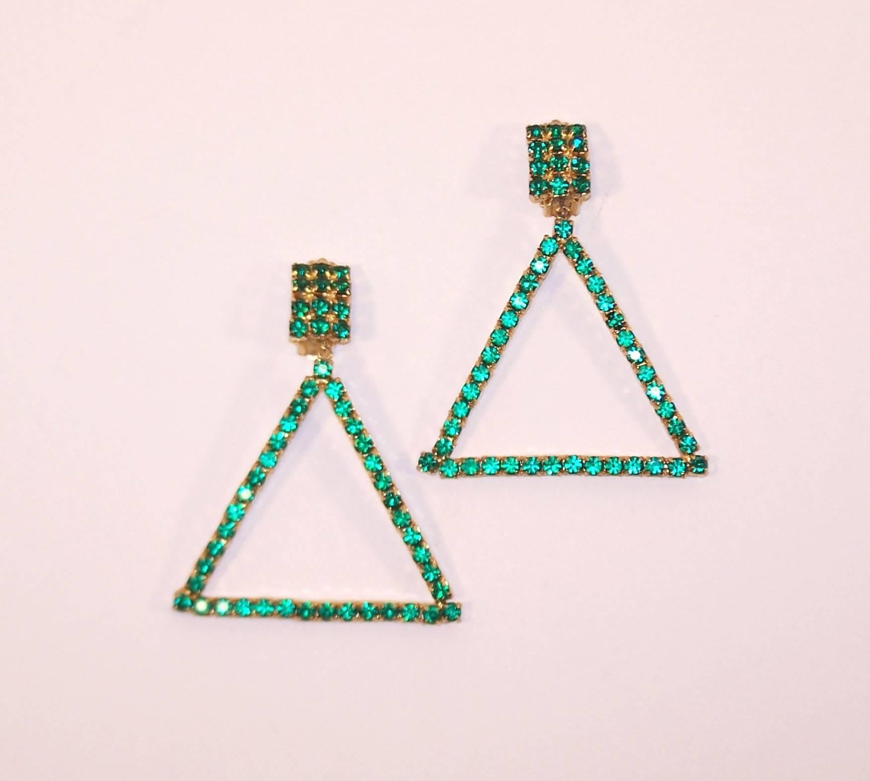 Combine a classic emerald green color and a 1960's mod triangular shape and you have a period perfect accessory for a modern ensemble.  These clip ons are light weight enough for all evening comfort and have just the right amount of movement to