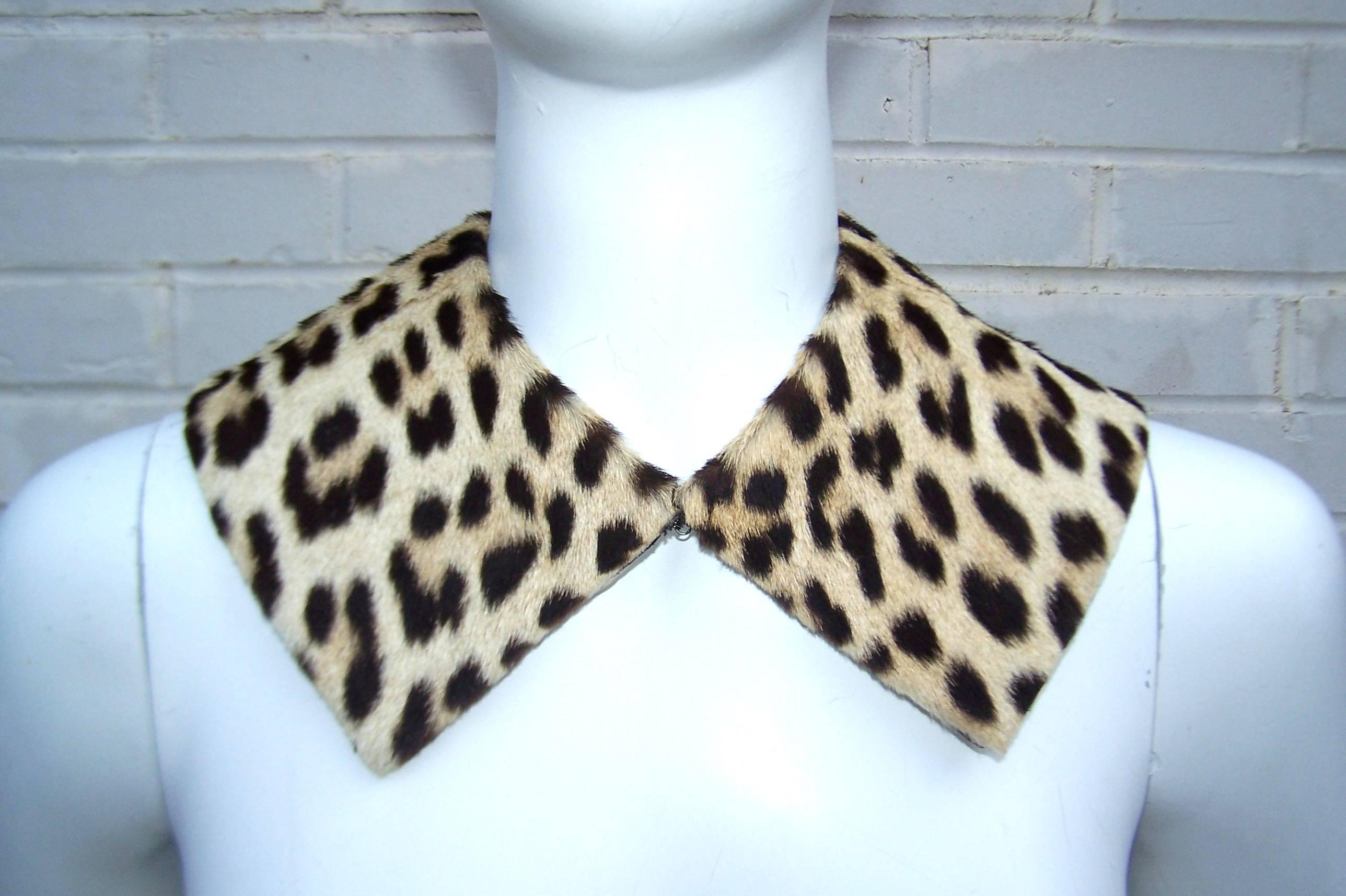 Add an exotic flavor to a coat, sweater, dress or jacket with this 1950's leopard print fur collar.  The collar hooks at the front and has a satin backing.  It can be worn like a necklace or stitch it onto a coat collar for a more permanent look. 