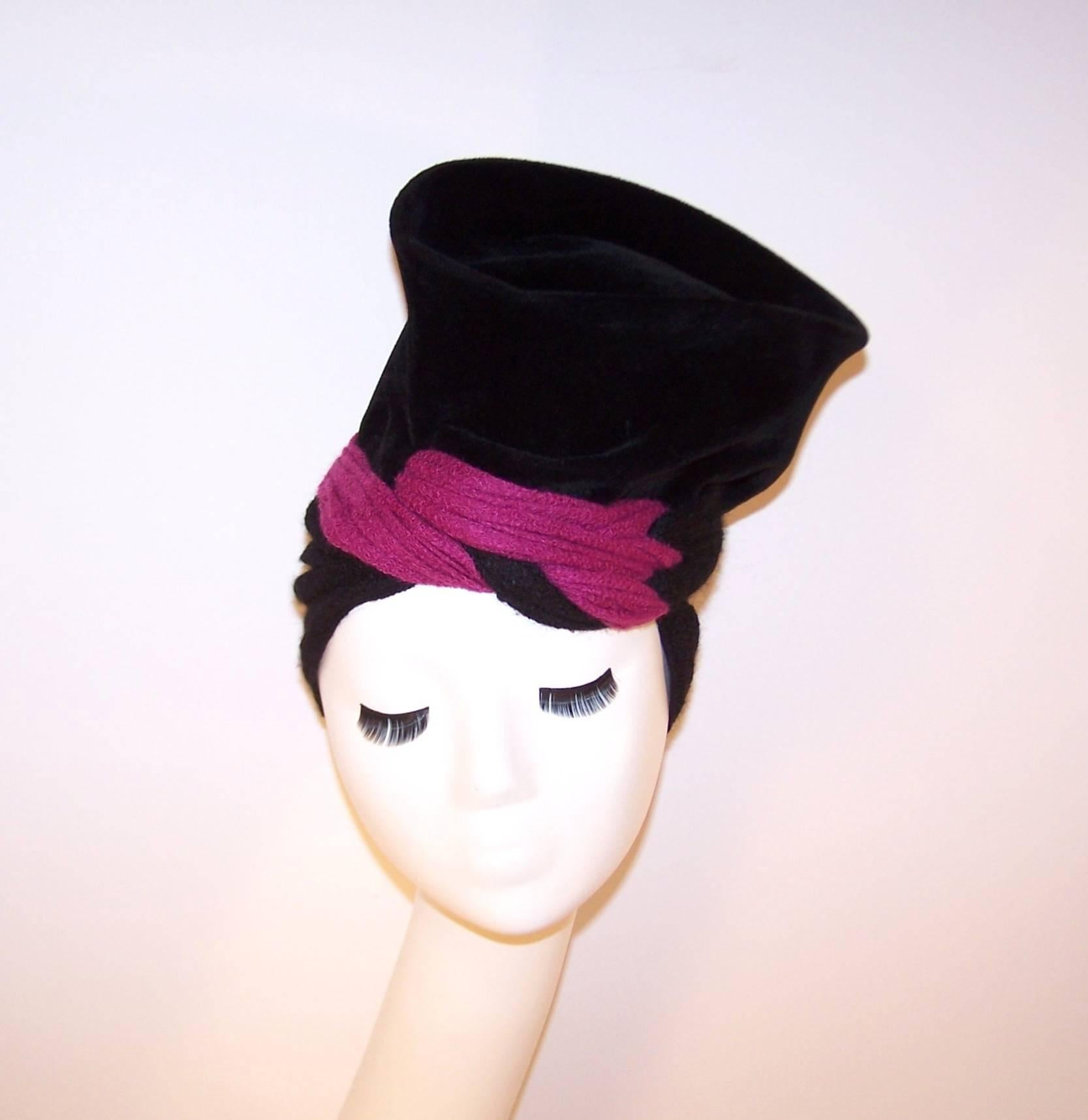 You are going to have so much fun with this hat!  The soft velvet body stands tall with a sculptural shape and the stretchy wool knit snood anchors everything in place.  The fuchsia pink color pop is an added bonus and makes this avant-garde hat a