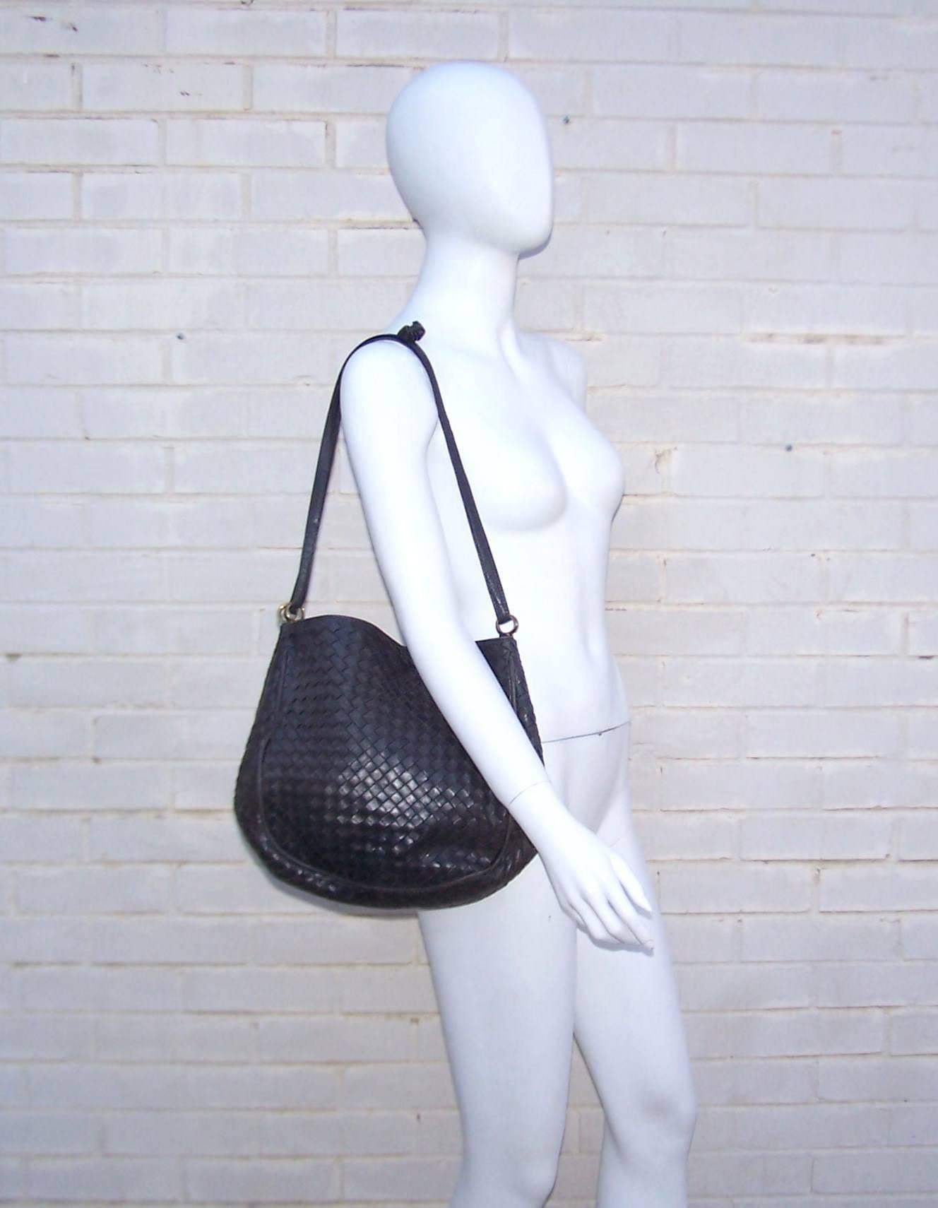 'When your own initials are enough'...such is the philosophy of the Italian fashion house, Bottega Veneta.  Bottega's unique 'intrecciato' woven leather design speaks volumes about style and quality without the necessity of a logo.  This charcoal