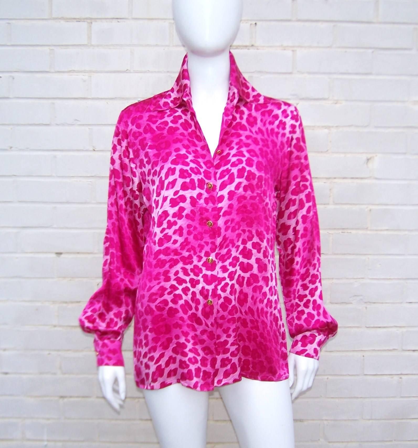 Escada goes wild!  This hot pink leopard animal print blouse gives a nod to menswear styles including a coordinating pocket square.  The attention to detail is evident in the luxurious silk charmeuse fabric and jewelry style enamel logo buttons. 
