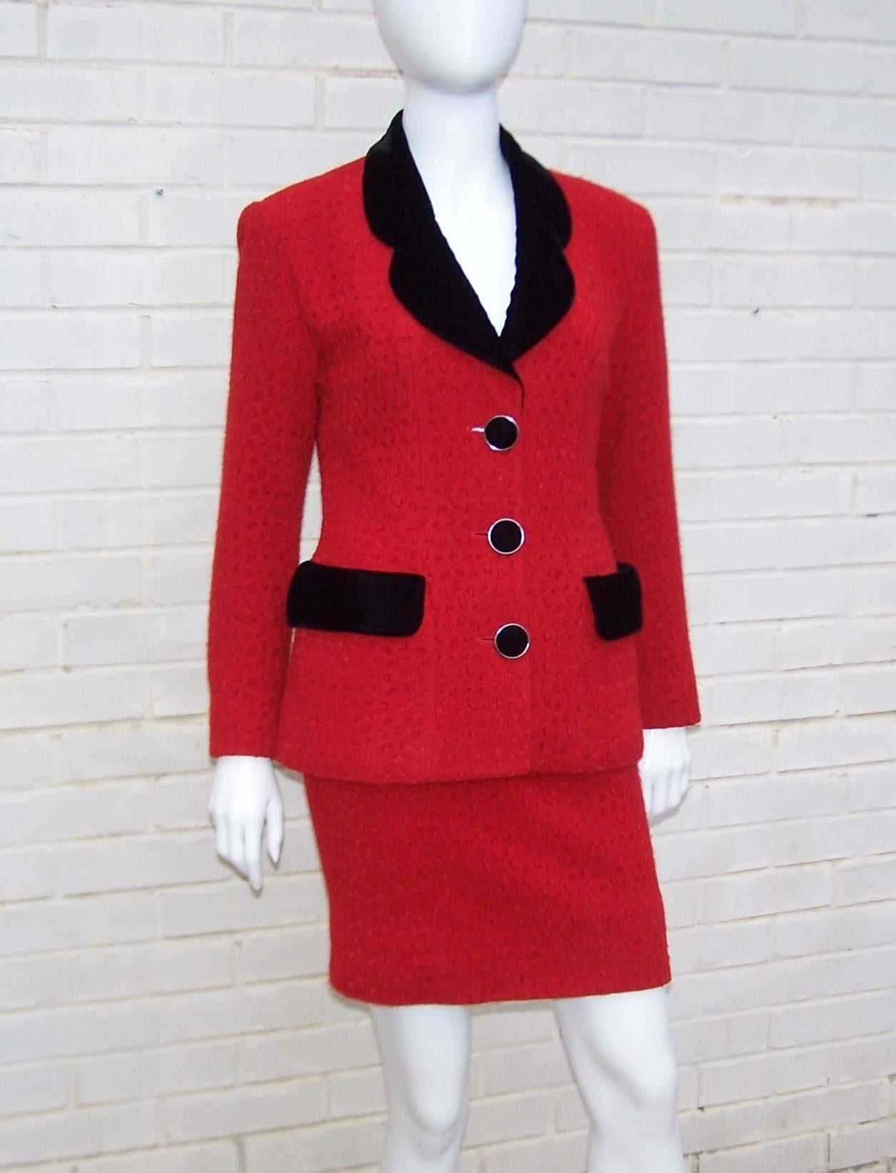 This beautiful red wool suit by Karl Lagerfeld is reminiscent of his designs for Chanel.  Classically cut with a textural red wool blend fabric that has the cozy feel of knitwear, the rich color is accented by black velvet collar, pocket flaps and