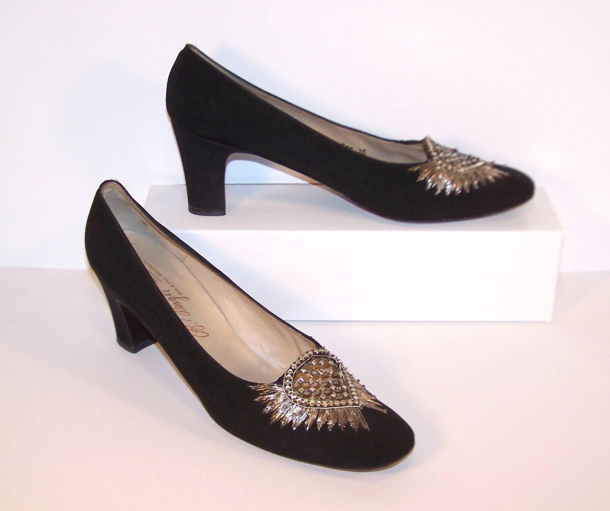 Fit for a queen!  These 1960's Bruno Magli evening shoes are a black silk faille fabric with metallic silver embroidery, beads and sparkling rhinestones at the vamp.  They are elegant and refined with an eye to craftsmanship...all hallmarks of the