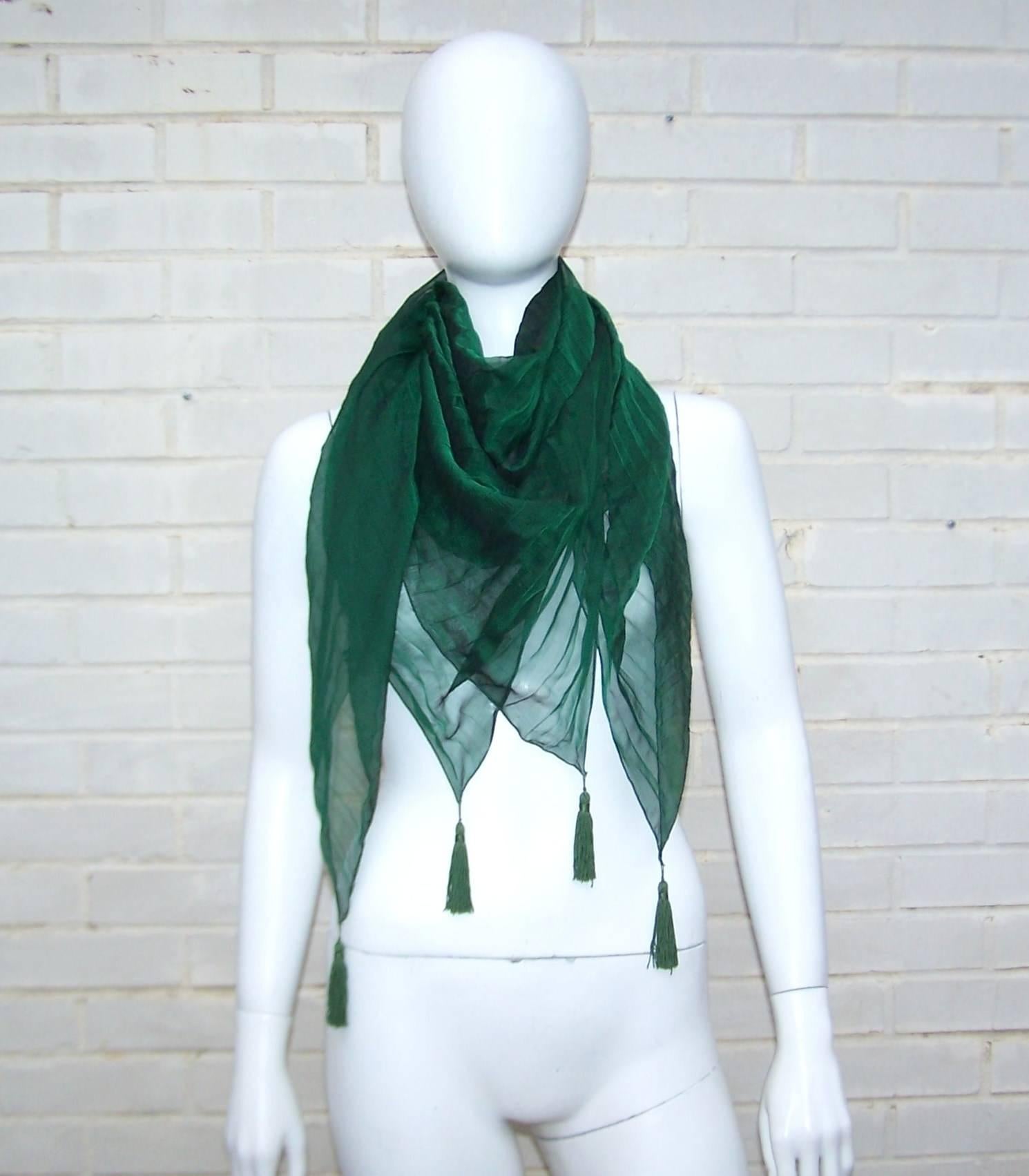 The ethereal quality of silk chiffon is used by Paris based Japanese designer Sayoko Miyajima to create a lovely 45" x 45" scarf which can moonlight as a wrap.  The rich emerald green color and 3" long corner tassels add to the visual