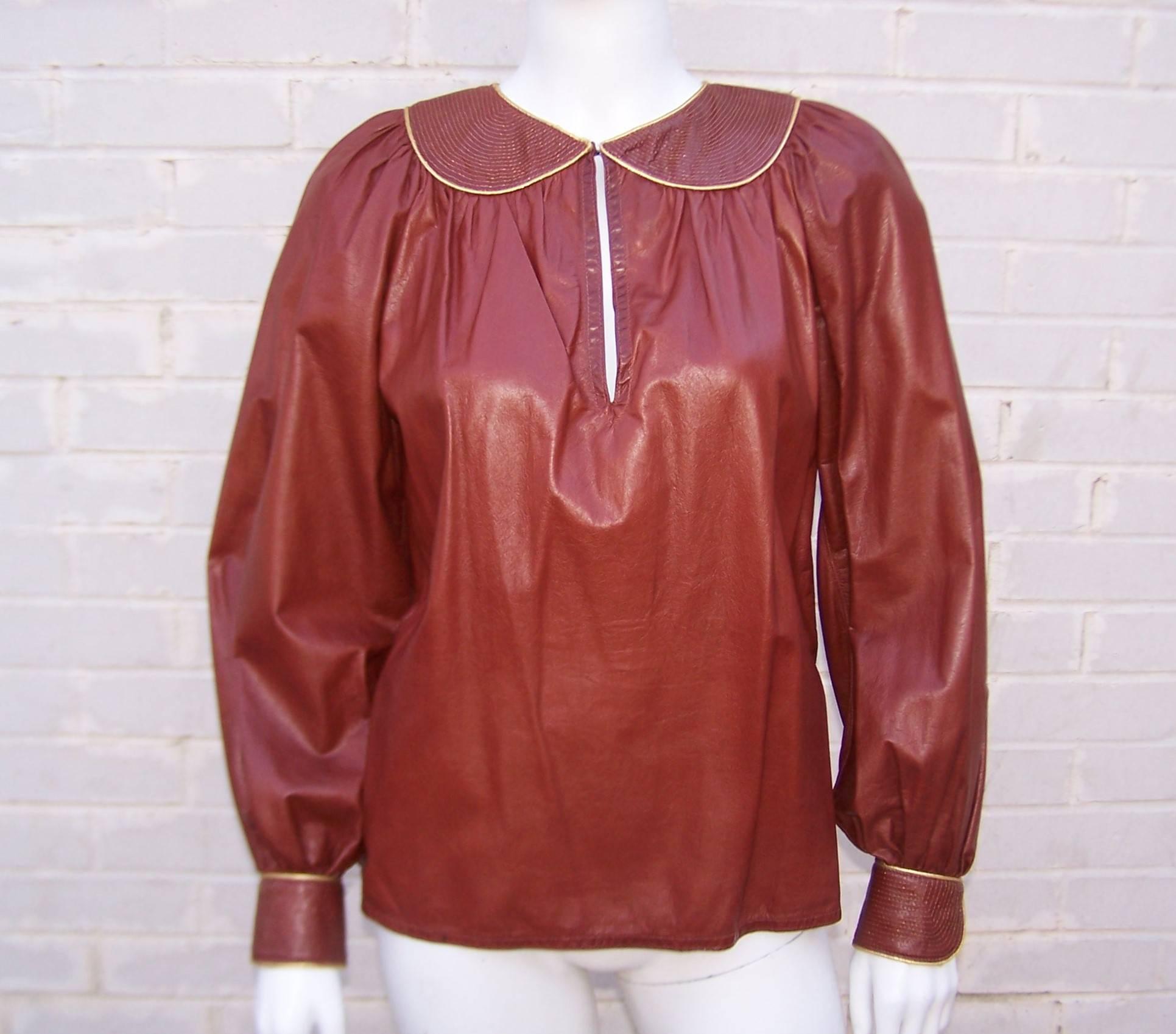 This 1970's leather top by Geoffrey Beene epitomizes classic American style ... the combination of luxurious details in a comfortable design.  The rich oxblood leather is supple and lightweight enough to sensually drape the torso with smock top