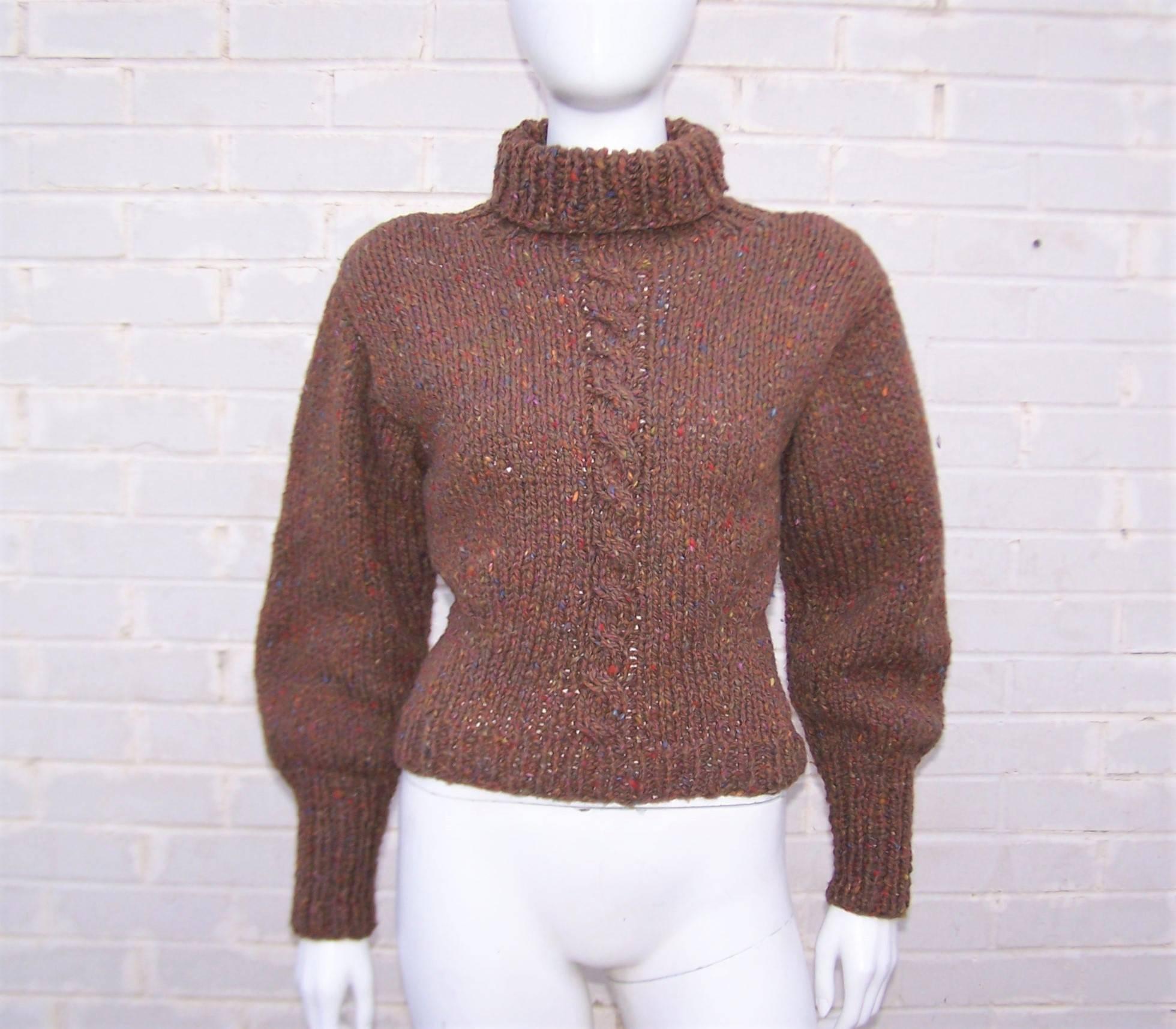 Gotta love a good sweater!  This one is from Perry Ellis and features a hand knitted design that combines a bulky wool with stylized details for maximum fashionable effect.  The brown tweed is peppered with red, blue and chartreuse highlights for
