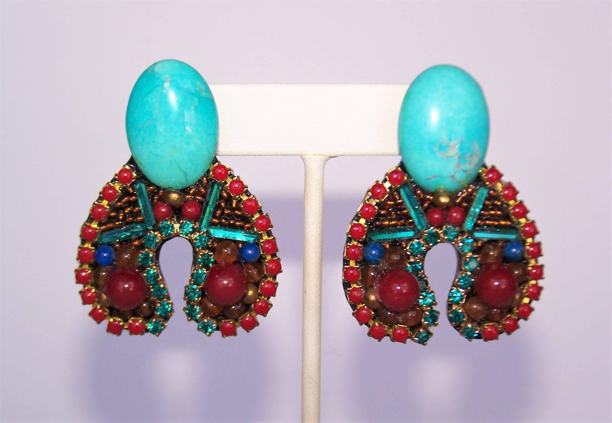 Bright turquoise and cherry red...what a lovely color combination!  These exotically styled earrings from M & J Hansen are a black resin base embellished with rhinestones and glass beads in turquoise, cherry red, amber, green and cobalt blue.  The