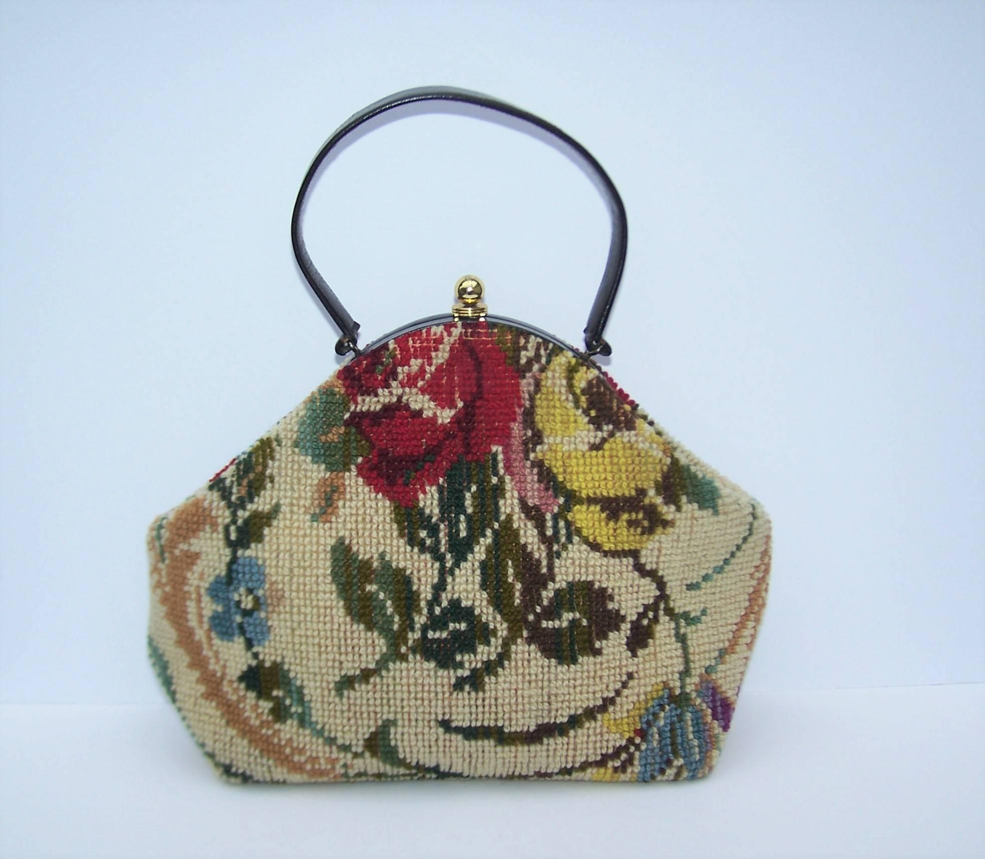 Jana is best known for producing Emilio Pucci's handbags in the 1960's and 1970's.  They also produced some fun carpetbag handbags and you are looking at a great example.  It securely closes at the top with a gold tone push closure.  The roomy