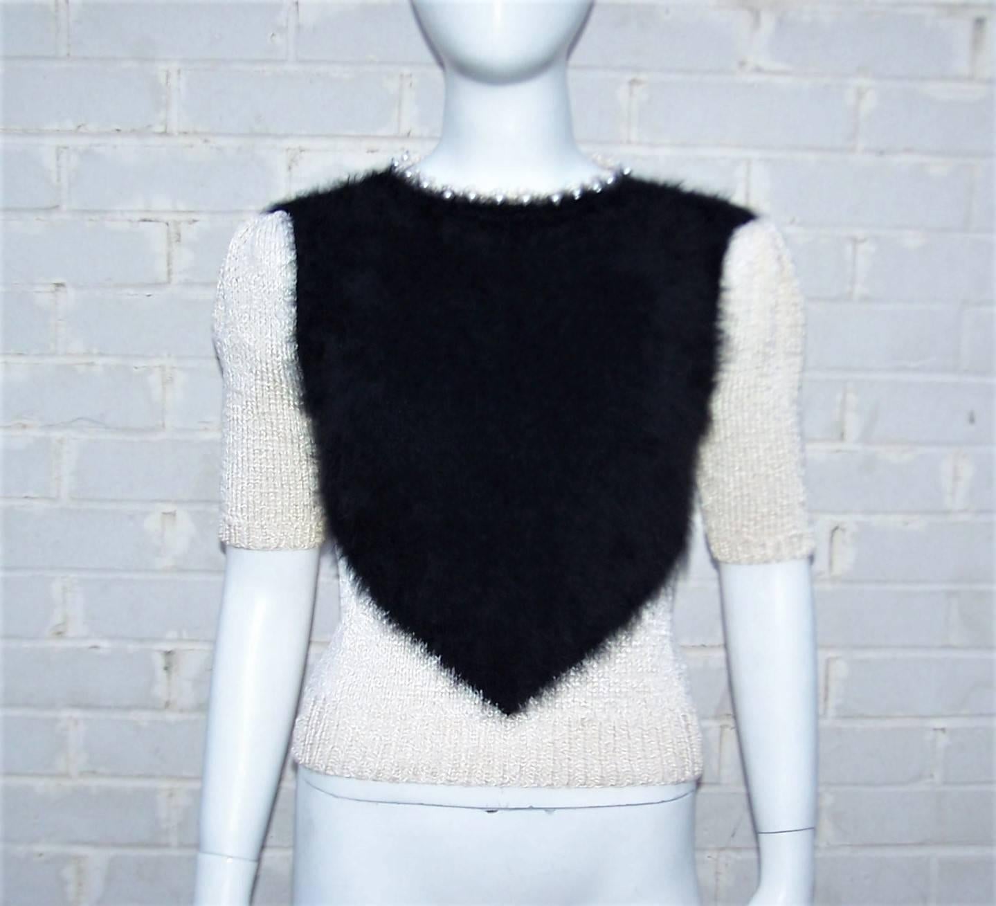 Alas!  The feminine version of a hairy chest!  This adorable glammy sweater top is a great visual combination of graphic black angora offset by pearly iridescent knitwear.  The effect is eye catching and perfect as an alternative top to pair with