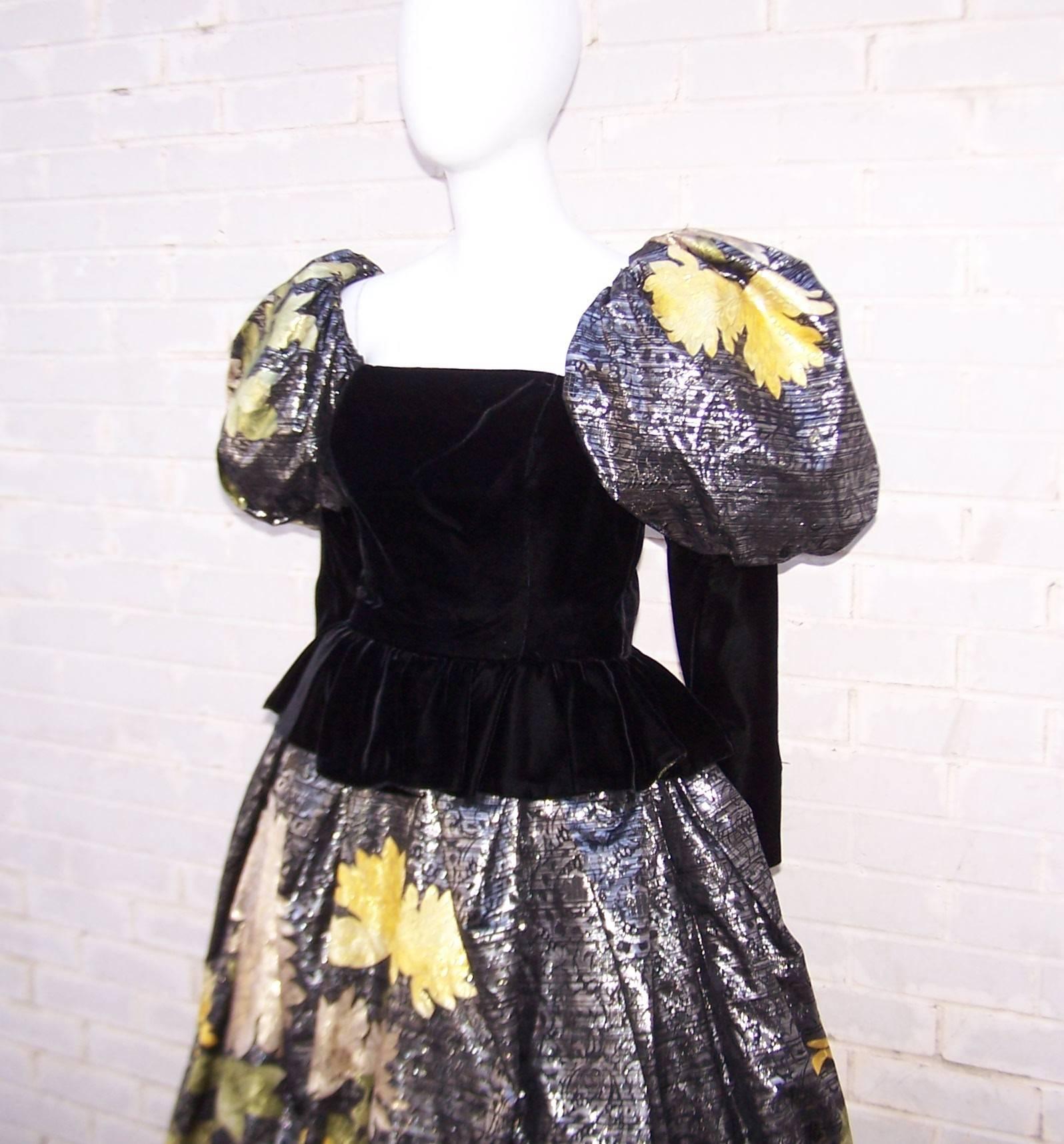 This over-the-top Leonard dress is a perfect example of the drama and opulence of fashion in the 1980's.  The fitted black velvet peplum bodice is offset by voluminous mutton sleeves and skirt made from a luxurious metallic silk fabric.  There is an