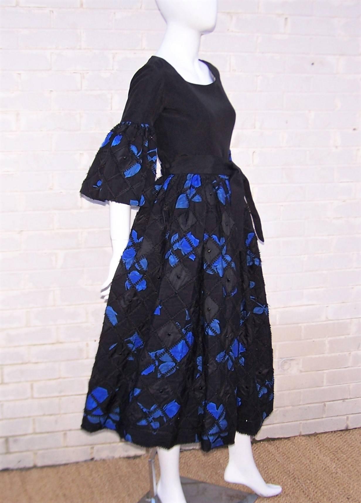 Fabulous!  Adolfo's designs from the 1970's are the epitome of ladylike charm and this two piece dress ensemble is here to prove it.  The pieces have a folkloric peasant dress style assembled from heavy black silk moire and coordinating electric