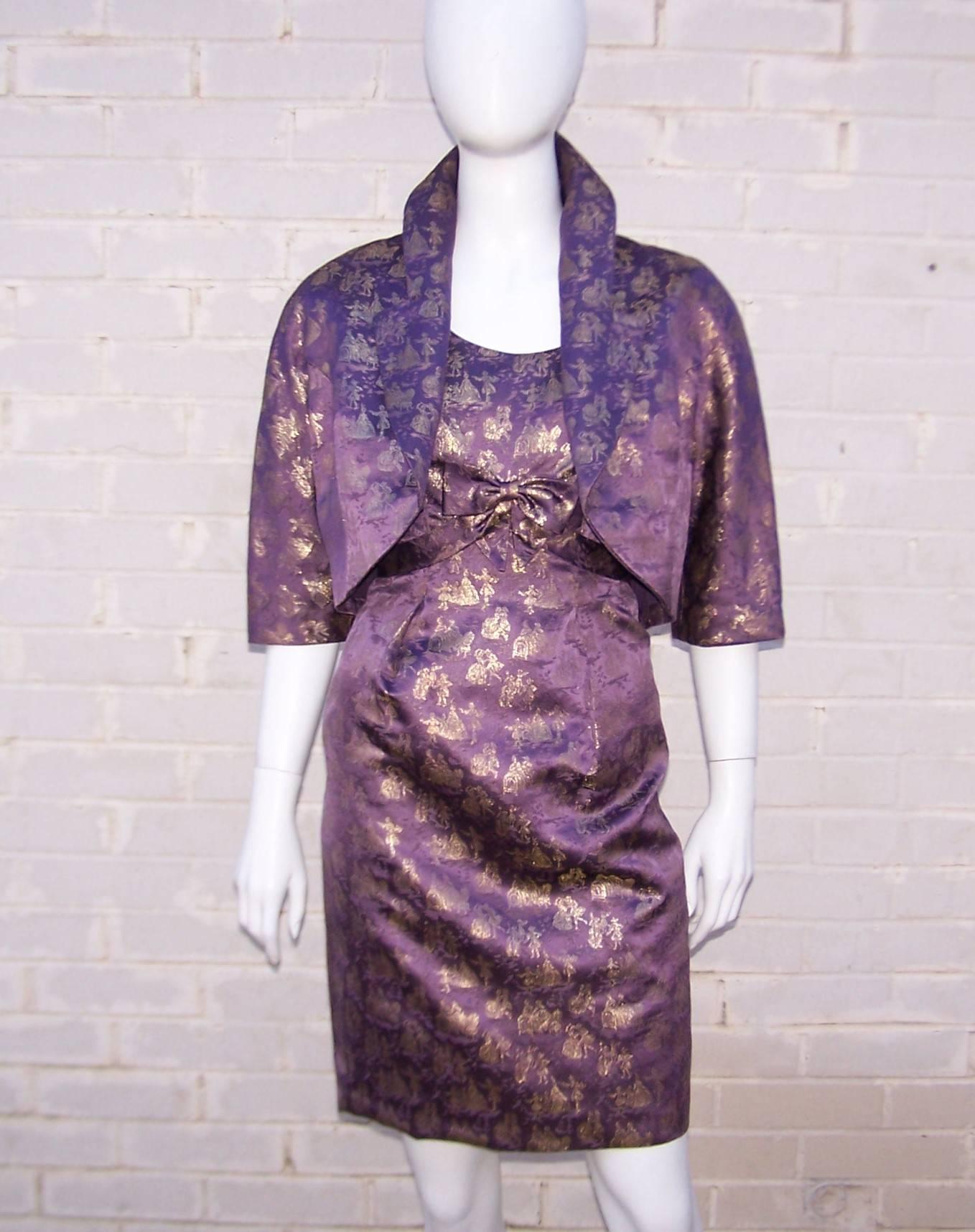 Oh the glamour of a 1950's wiggle dress!  Fantastic...especially when it is accompanied by a coordinating cropped jacket and tuxedo style scarf embellished with mink tails.  This three piece cocktail dress ensemble is a purple and gold lame toile