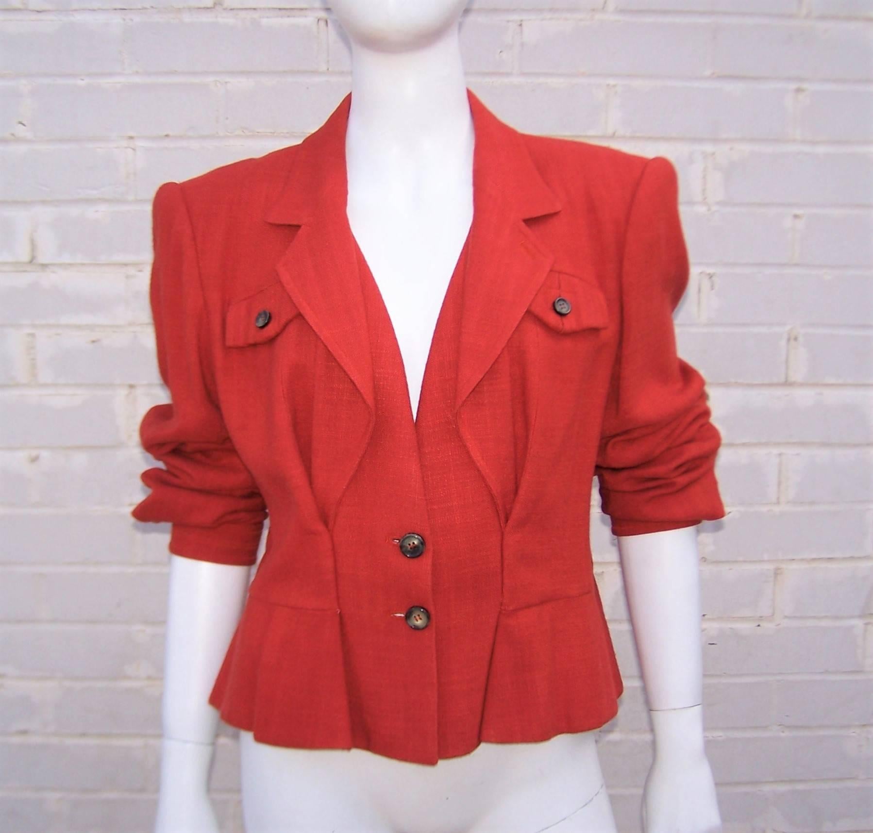 Nips and tucks abound on this stylish 1990's version of a safari jacket from Yves Saint Laurent.  The collared jacket can be worn as a secondary layer or solo with faux horn buttons at the front, breast pockets and cuffs.  The nod to 1940's styles
