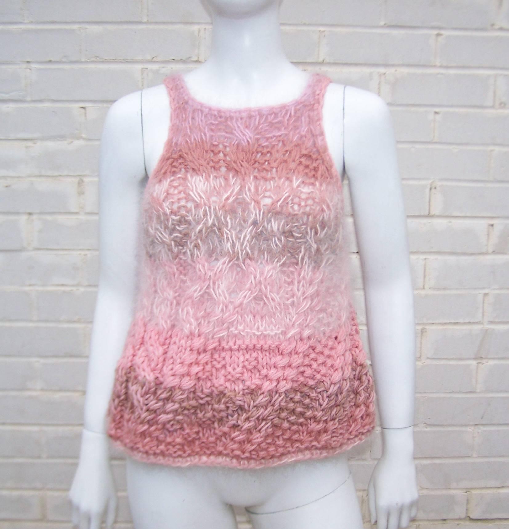 Get prepared to be touched!  This Joan Vass angora sweater top is irresistable!  The hand knit powder pink angora is mixed with a light brown and darker pink wool and on close inspection you can see a hint of blue towards the hemline.  The trapeze