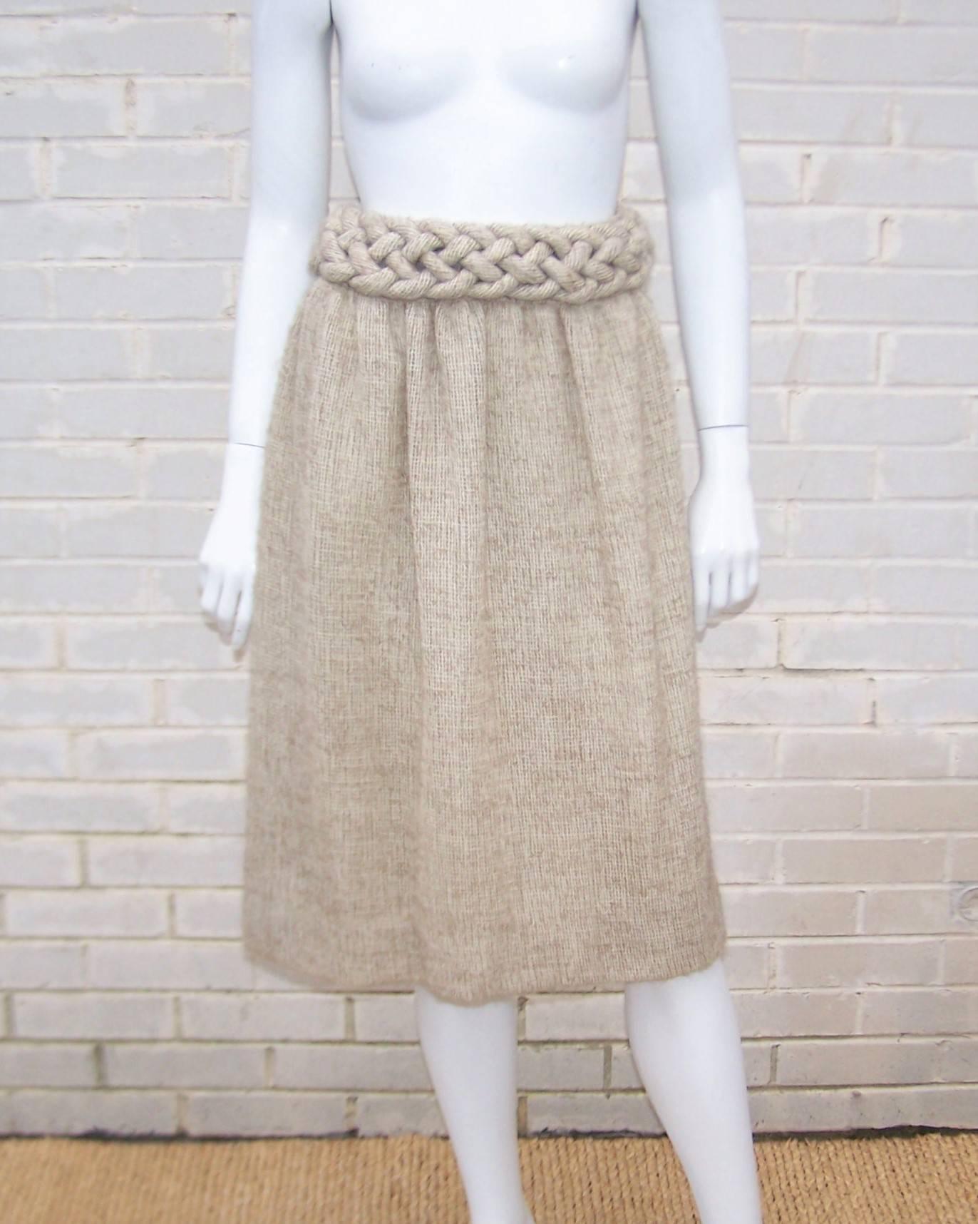 It's not usually a compliment to compare an article of designer clothing to a potato sack but Mary McFadden has managed to take it to a new level.  This soft burlap style fabric is an open weave with what appears to be a mohair blend making it a
