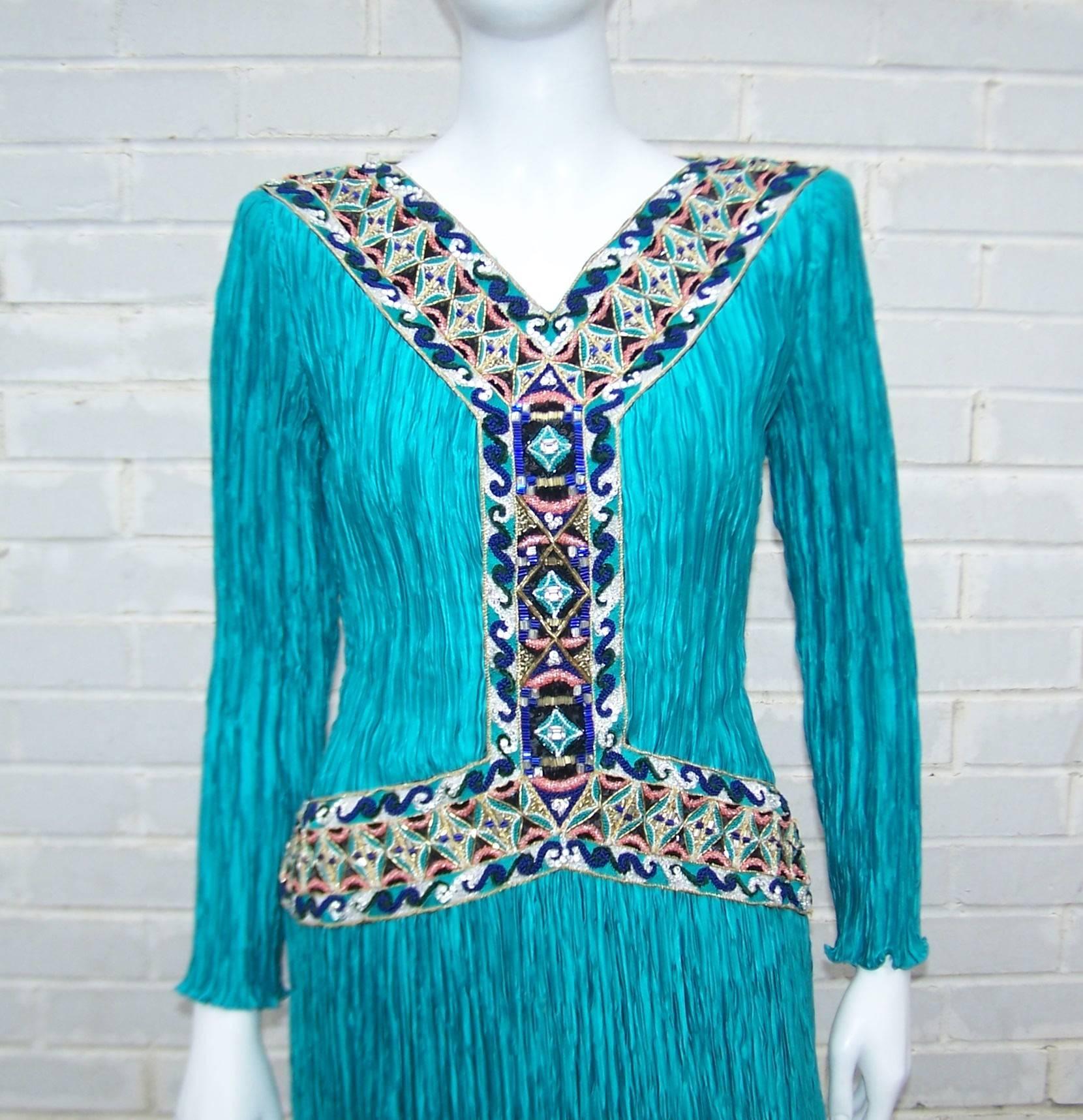 Create a modern day Cleopatra look with this stunning Mary McFadden Couture goddess dress from the 1980's.   The turquoise micro pleated fabric is a nod to the feminine designs of Mario Fortuny and is an iconic feature of Ms. McFadden's style.  The