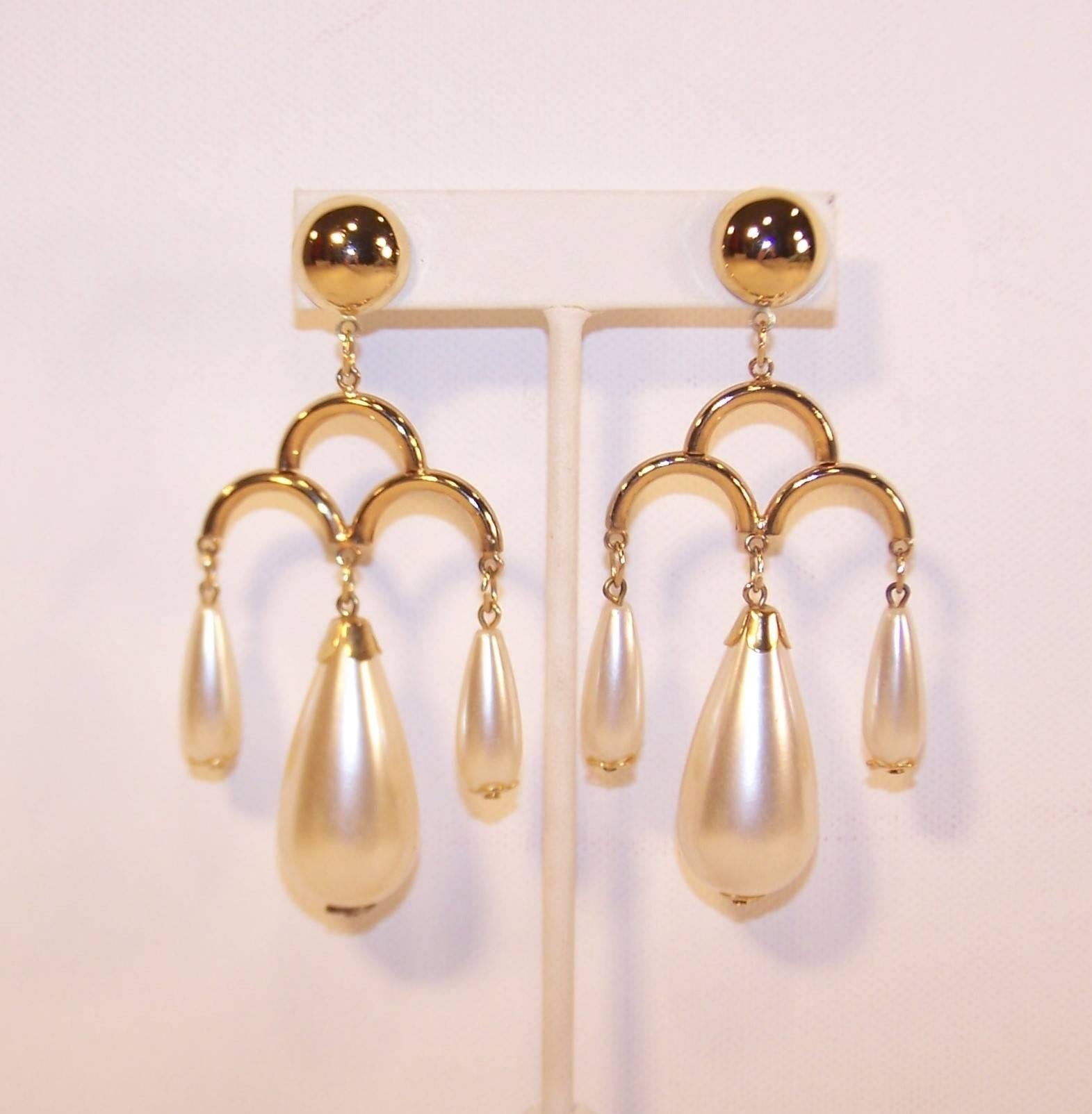 Wowza!  These 1970's earrings offer the best of both worlds...large and comfortable!  Though they are sizable and appear weighty, the tubular gold tone metal components ensure ease of wear.  The half sphere bases have pierced backings and suspend
