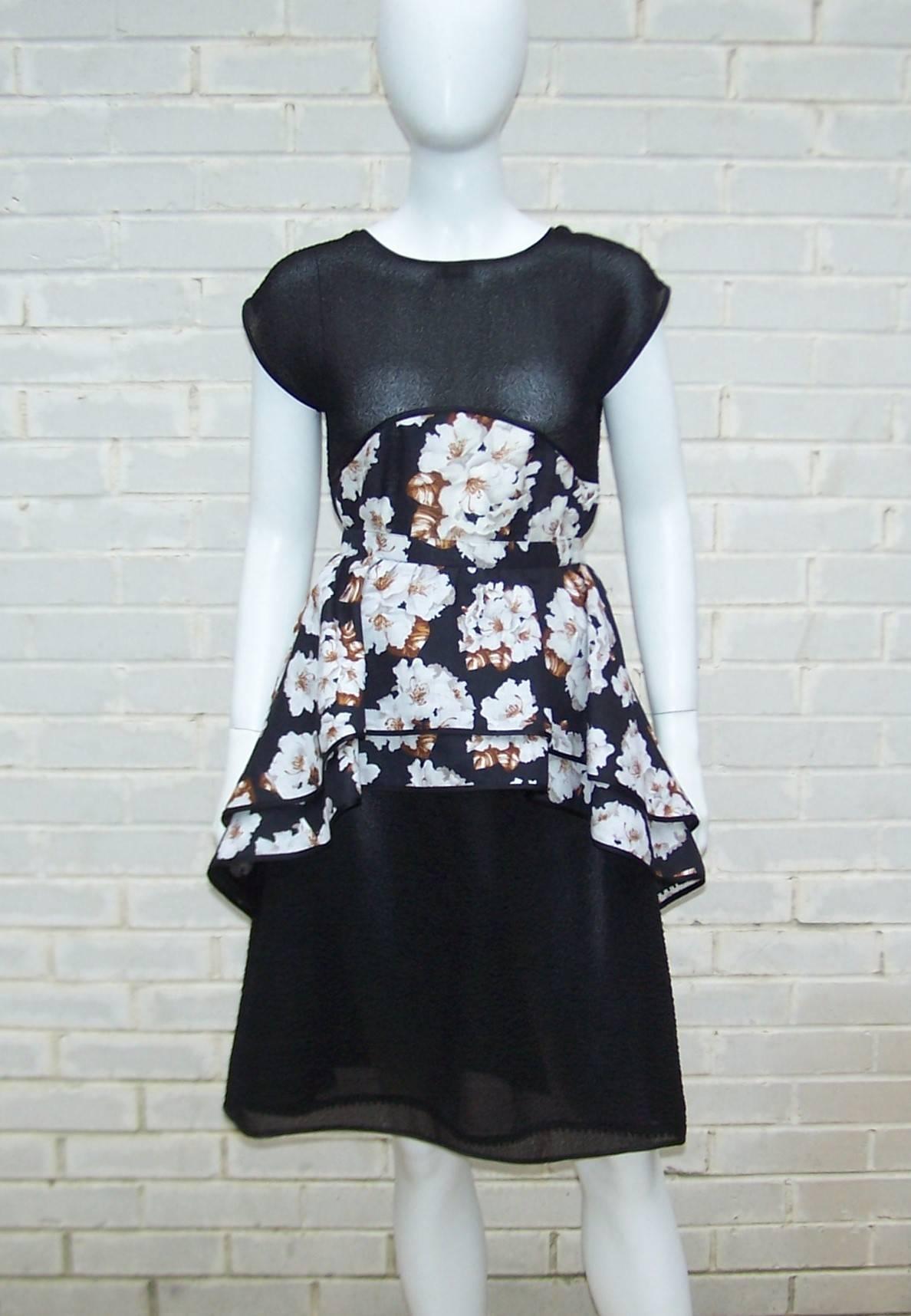 This 1970's Geoffrey Beene two piece dress ensemble is a vision of loveliness.  Both pieces are are a combination of a unique puckered black sheer fabric which appears to be an organza style silk and a floral linen depicting white flowers with brown