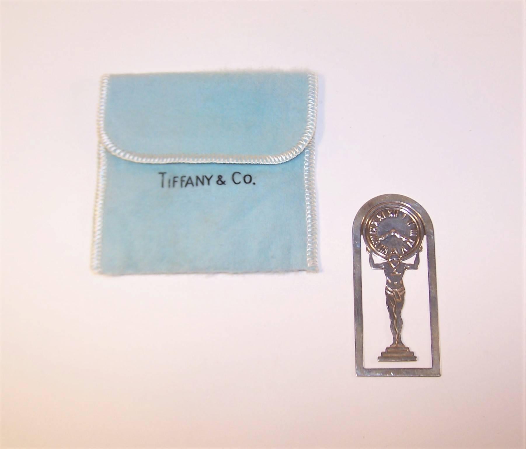 Mark a page with your favorite strongman!  This Tiffany & Co. sterling silver bookmark features an art deco style Atlas supporting a Roman numeral clock.  Perfect as a gift for your favorite bibliophile and complete with a Tiffany blue storage