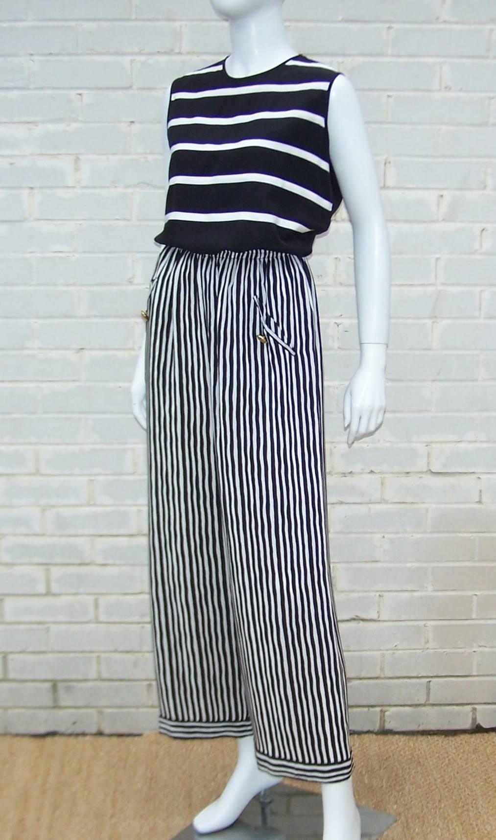 This 1970's Adolfo silk ensemble is a great combination of graphic stripe design and comfortable construction.  The simple black and white sleeveless top buttons at the back with an exaggerated keyhole neckline and acts as the perfect foil to pull