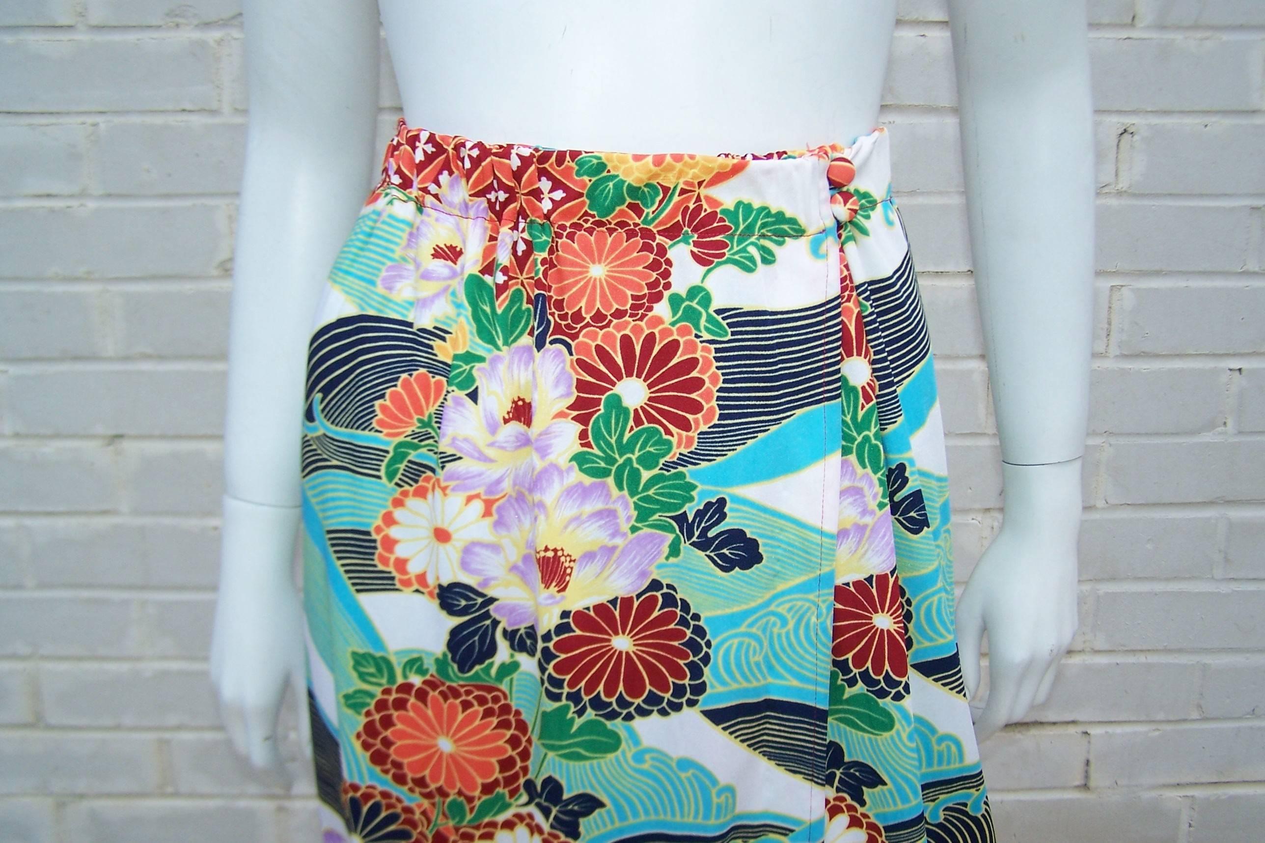 Lea Gottlieb founded Gottex in Israel during the 1950's with the eye to design colorful beach wear stylish enough to go from 'pool to bar'.  This 1970's wrap skirt with an Asian themed floral print with abstract waves is the perfect cover up for