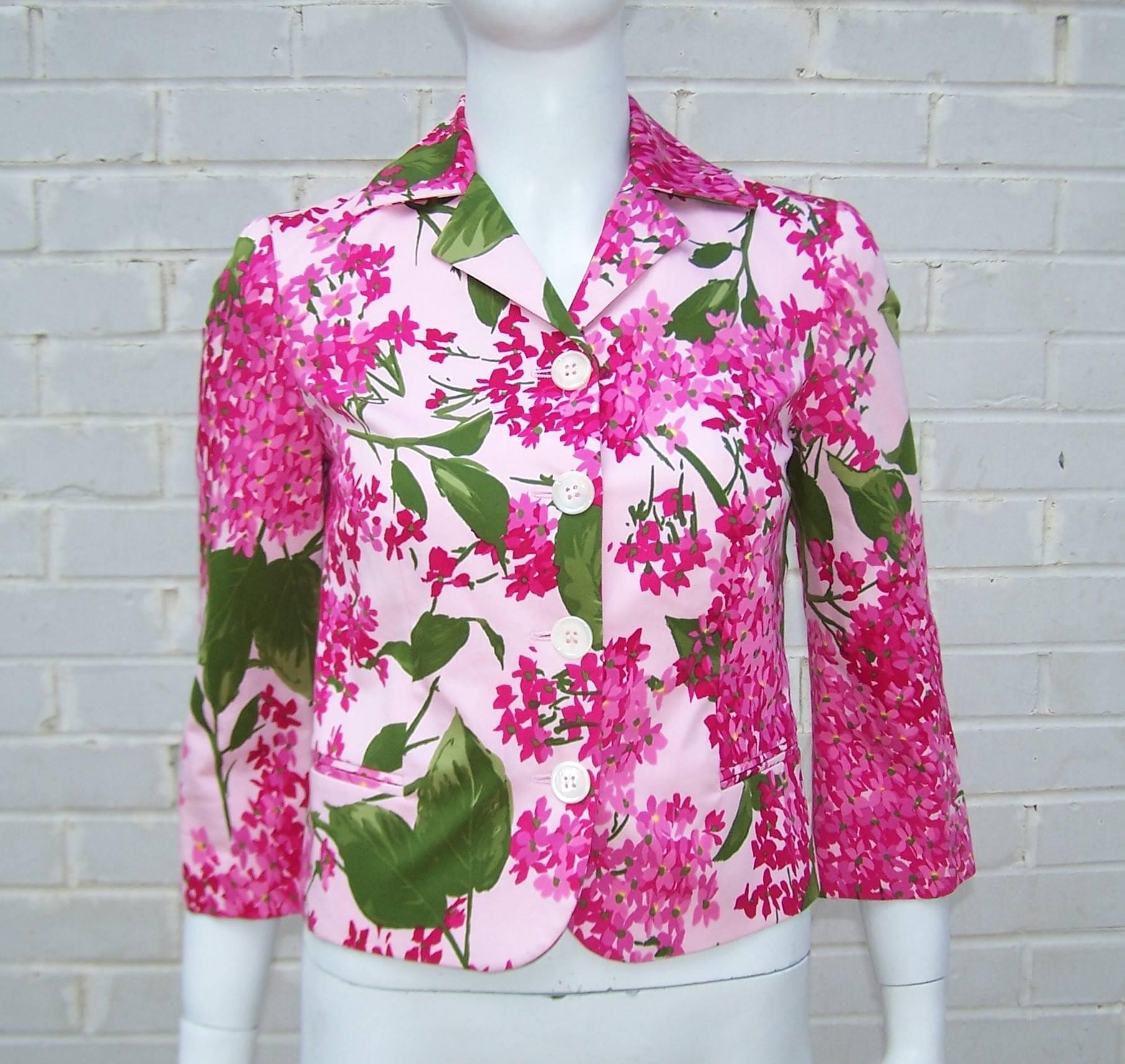 Franco Moschino has created an adorable 'Cheap And Chic' jacket with all the color and crispness of a beautiful Spring day.  The polished cotton fabric depicts hydrangeas in pinks and fuchsia colors accented with two tones of green and a touch of