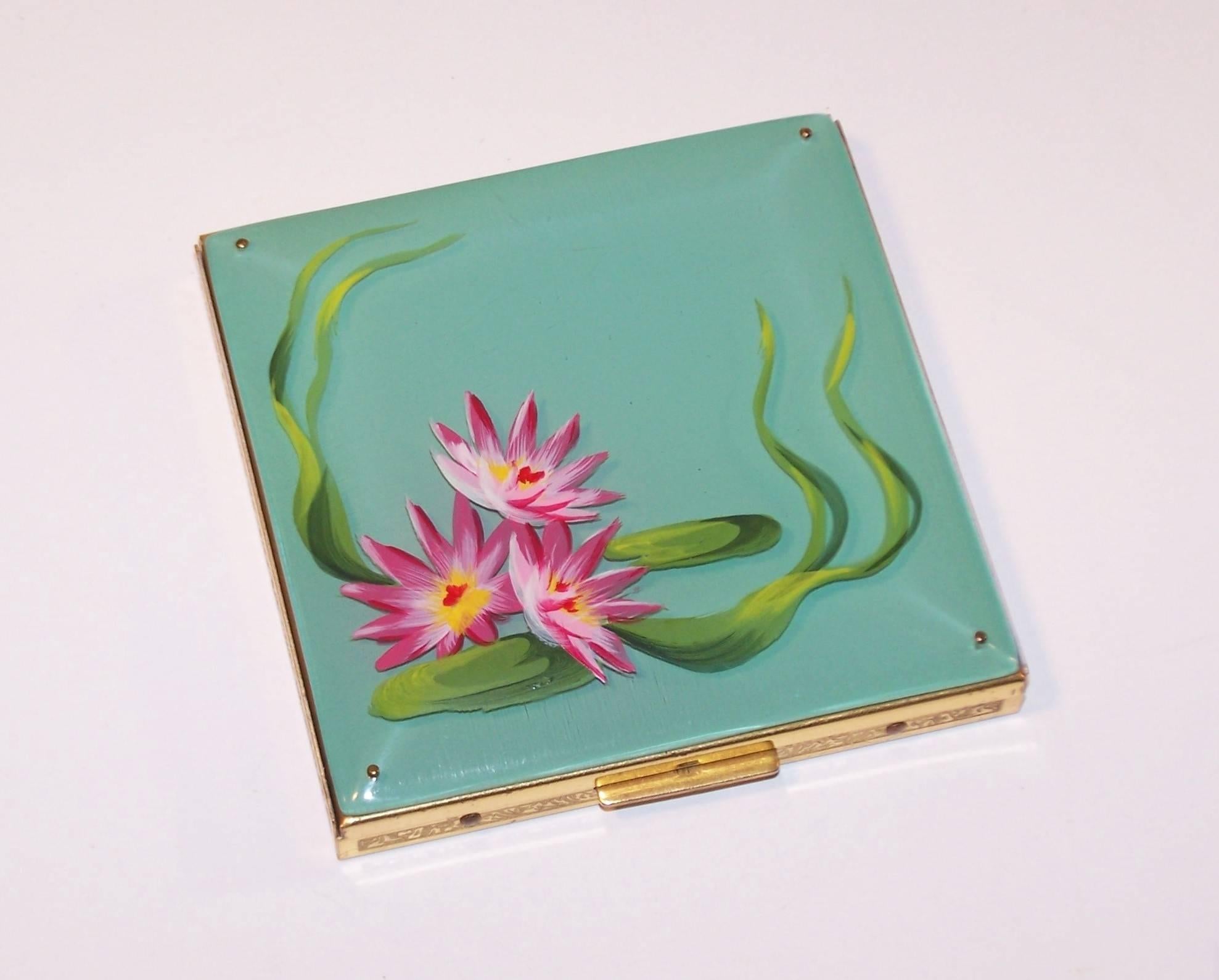 This lucite compact by Rex of Fifth Avenue is mesmerizing.  The colors and 3-D effect of the lucite with reverse paint to the underside and hand painted floral imagery on the top side create a glow that make this mirrored powder compact more