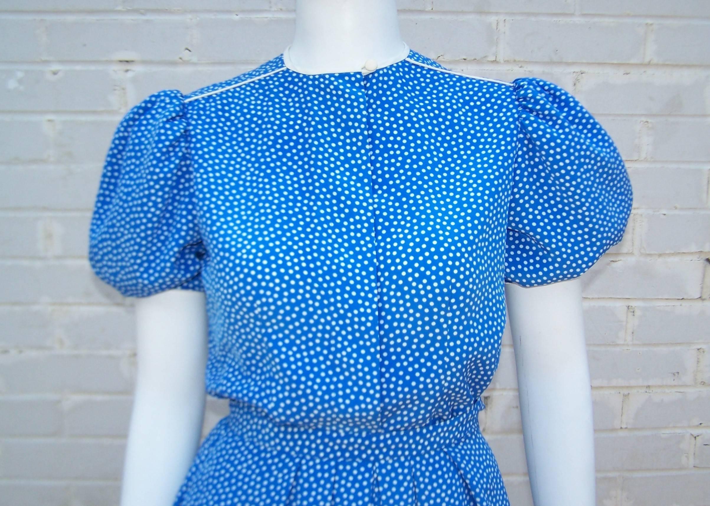 This ladylike electric blue and white polka dot silk ensemble by Albert & Pearl Nipon is loaded with lovely details typical of the Albert Nipon label.  The top has hidden buttons at the front with white cording at the neckline, shoulder and puffed