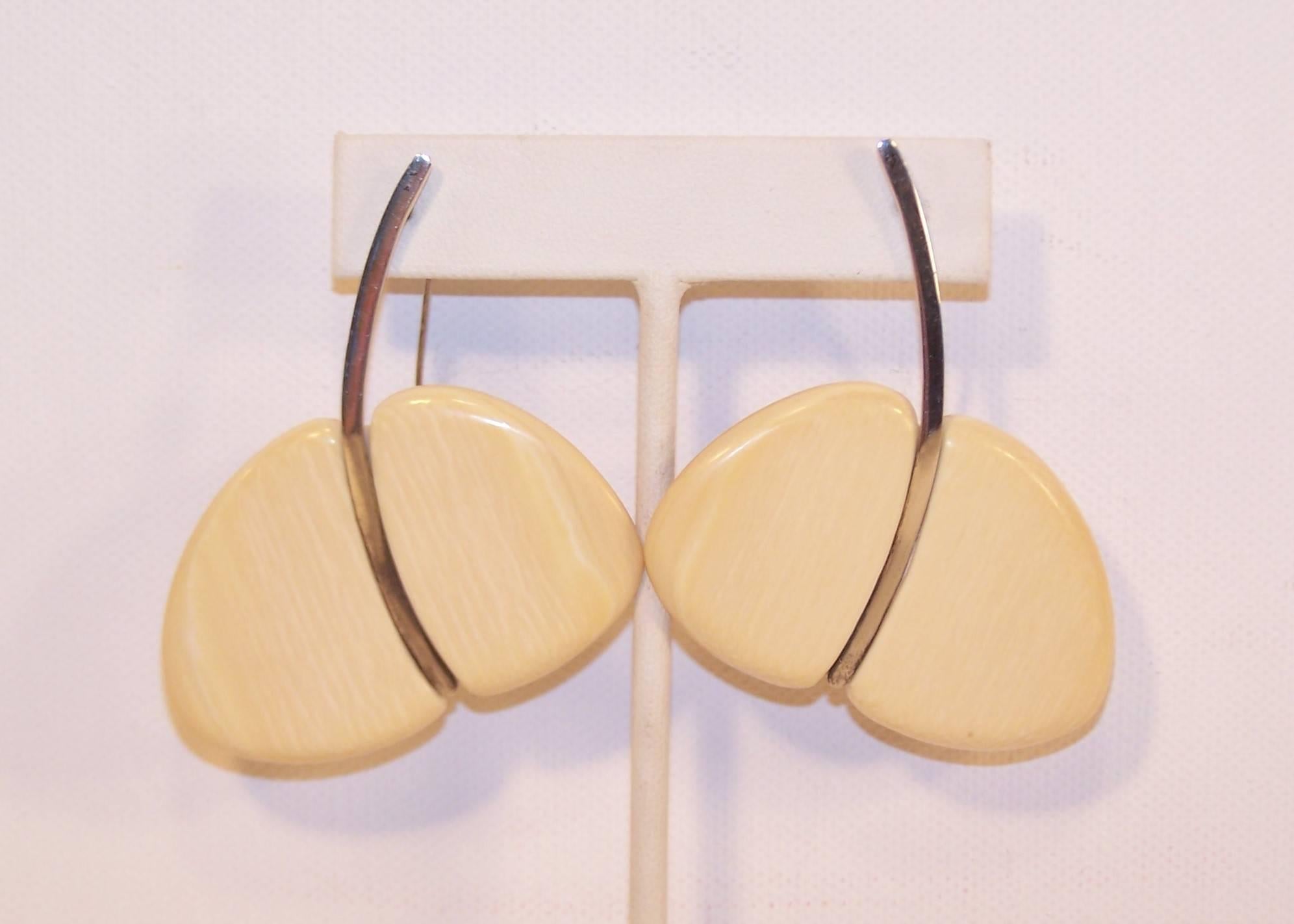 These unique artisan earrings have a sculptural shape that is as modern today as they were in the 1970's.  Each earring measures 2" at the widest point x 2.5" at the longest which provides quite a statement look.  They are expertly