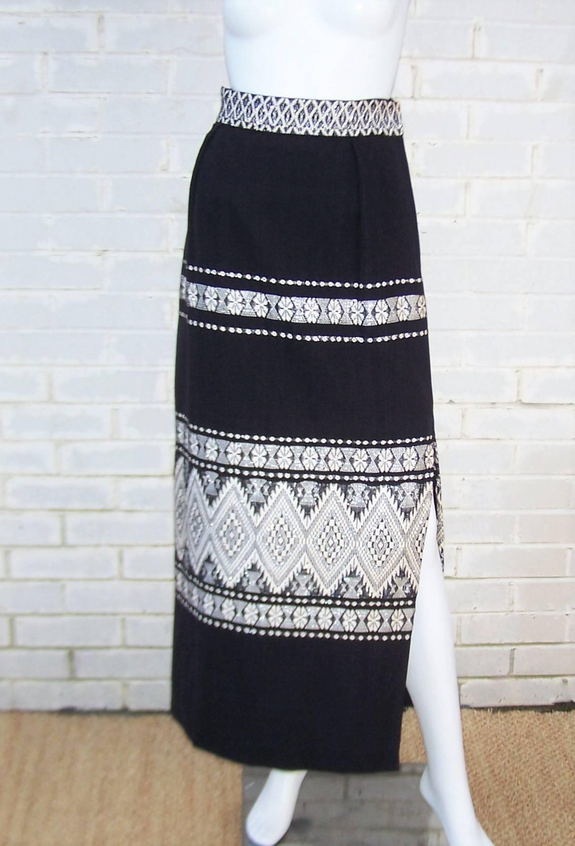 The texture and eye catching graphic design of this C.1970 Lanza Mex skirt is a period perfect combination of style and folkloric Mexican weaving traditions.  The maxi skirt zips and hooks at the side with a high slit and full lining.  The black