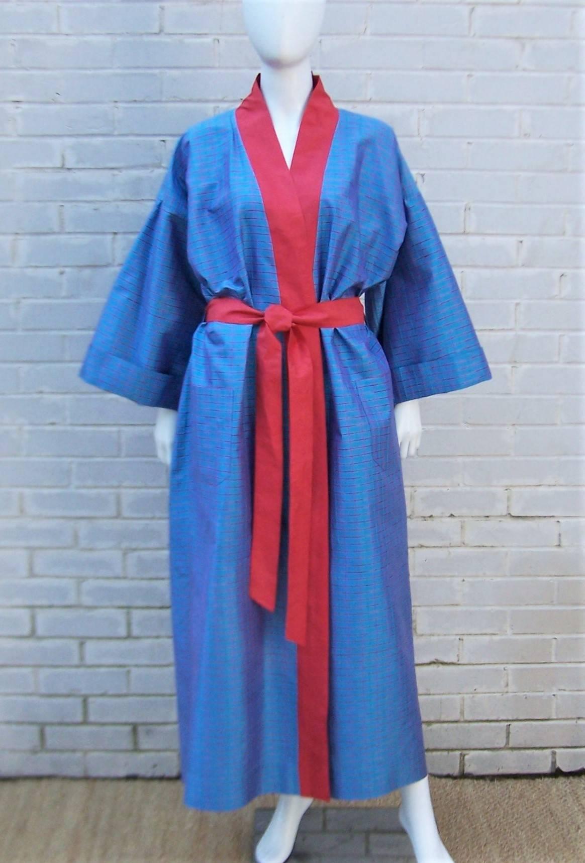 Take lounging to a whole new level with this Jim Thompson robe made from hand woven Thai silk in a brilliant blue windowpane design with tomato red accents, collar and sash.  Jim Thompson was an American art collector who dedicated himself to