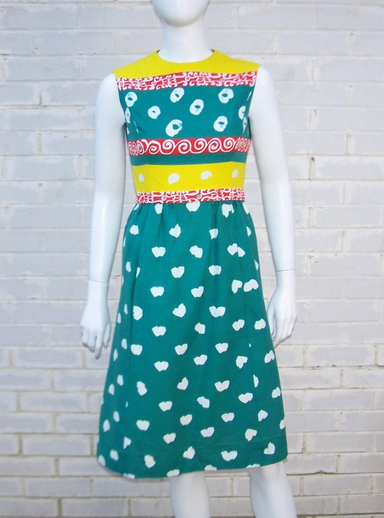 Get ready for a color punch with this C.1970 Elinor Simmons design for Malcolm Starr.  The two piece dress set combines teal green, bright yellow, tomato red  and white colors in a heavy linen fabric.  The abstract pop art patterns are akin to a